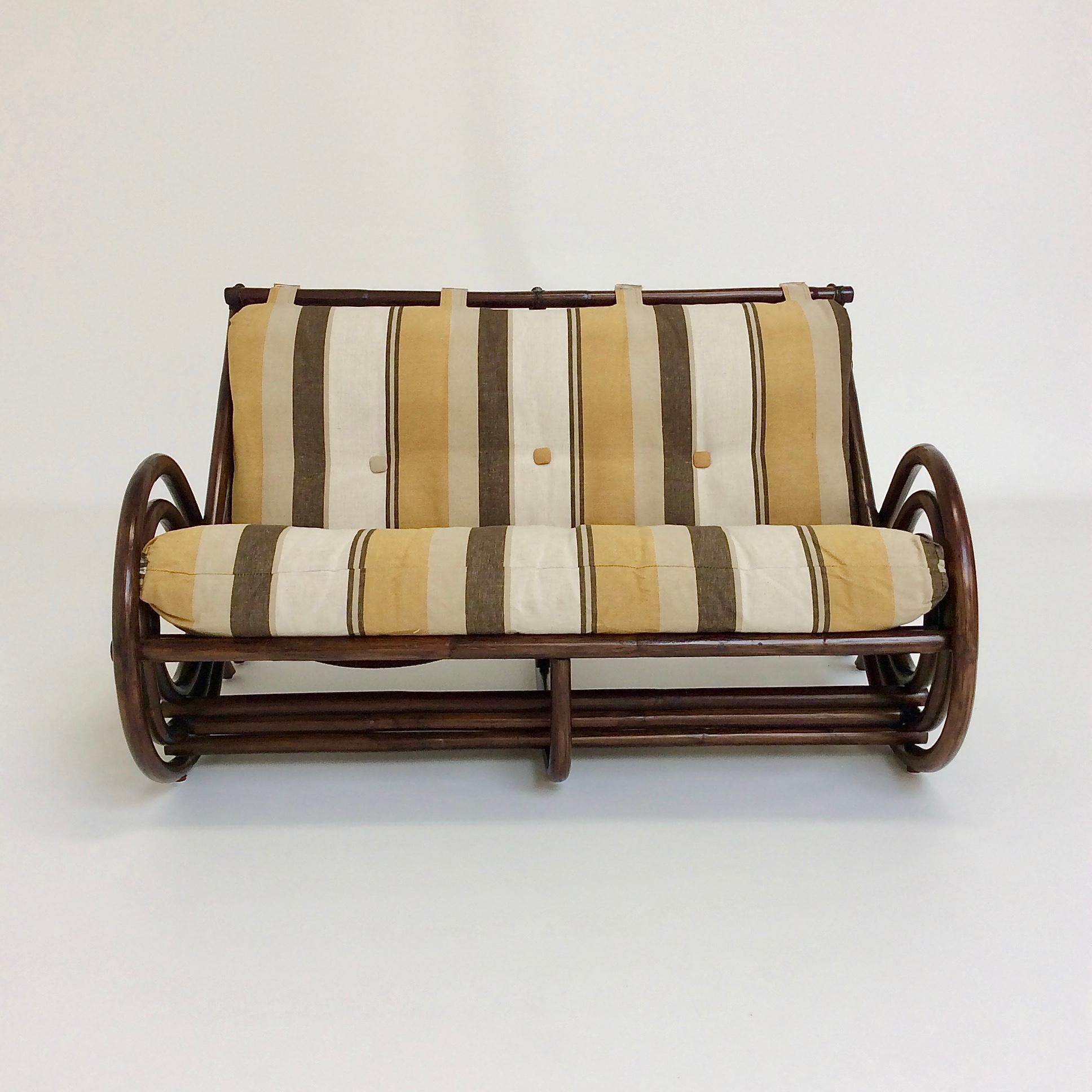 Two-seat sofa, circa 1970, Italy.
In the style of Vittorio Bonacina
Brown tinted bamboo, original striped cotton fabric.
Dimensions: 124 cm W, 87 cm D, 71 cm H, seat height: 40cm.
Good original vintage condition.
All purchases are covered by