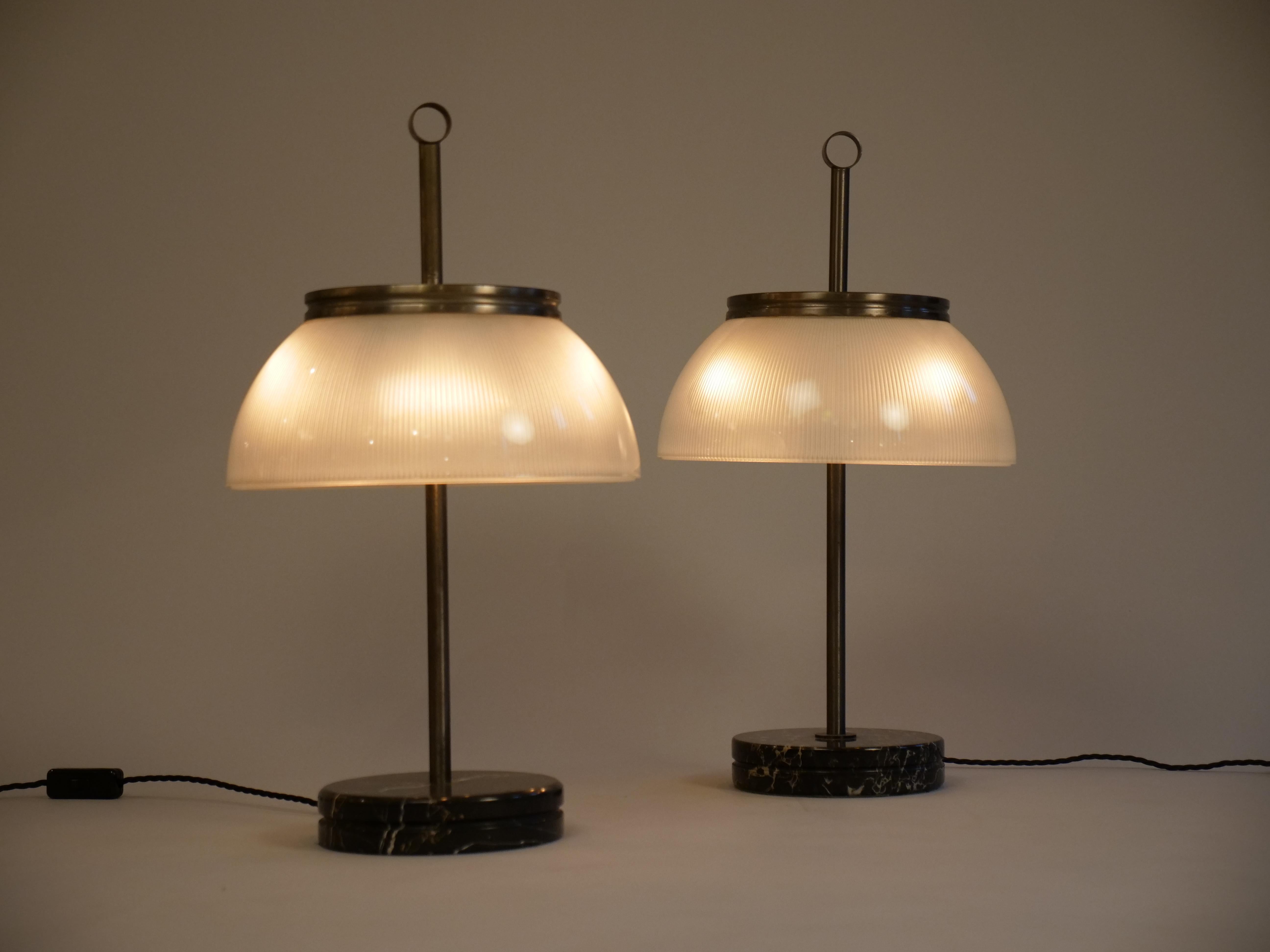 Matched pair of original Sergio Mazza table lights from 1960s Italy

Marble, glass and nickelled brass.

Original edition from 1960s with the 'ring' finial 

All in very good condition. No chips or nicks to marble or glass