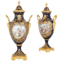 Deux vases de style Sèvres en porcelaine et bronze doré