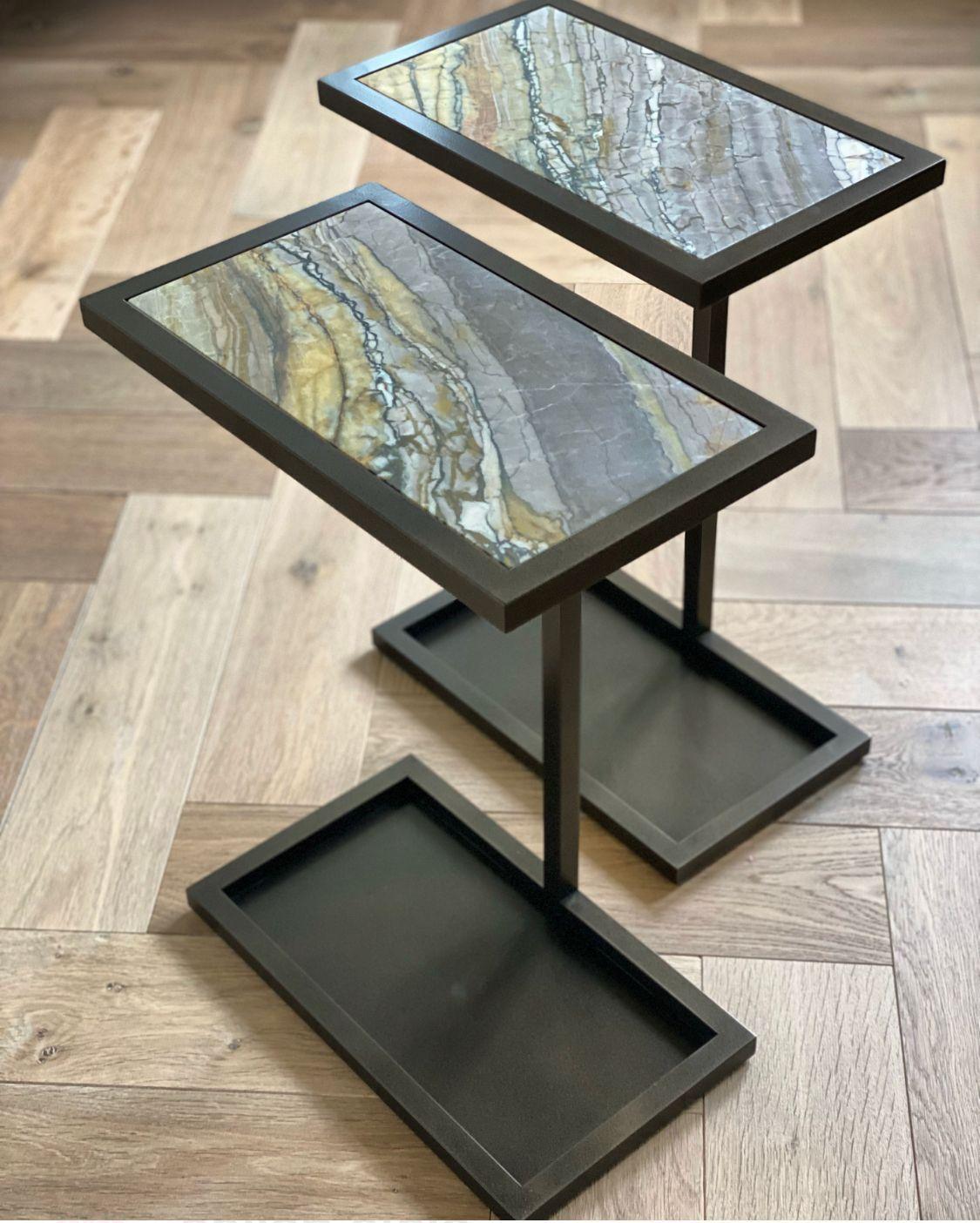 The Martinez table with two shelves boasts an architectural aesthetic and can stand confidently as a sculpture on its own. Its simple and sleek design exudes luxury and subtle glamour. The table comes in various finishes including powder-coated
