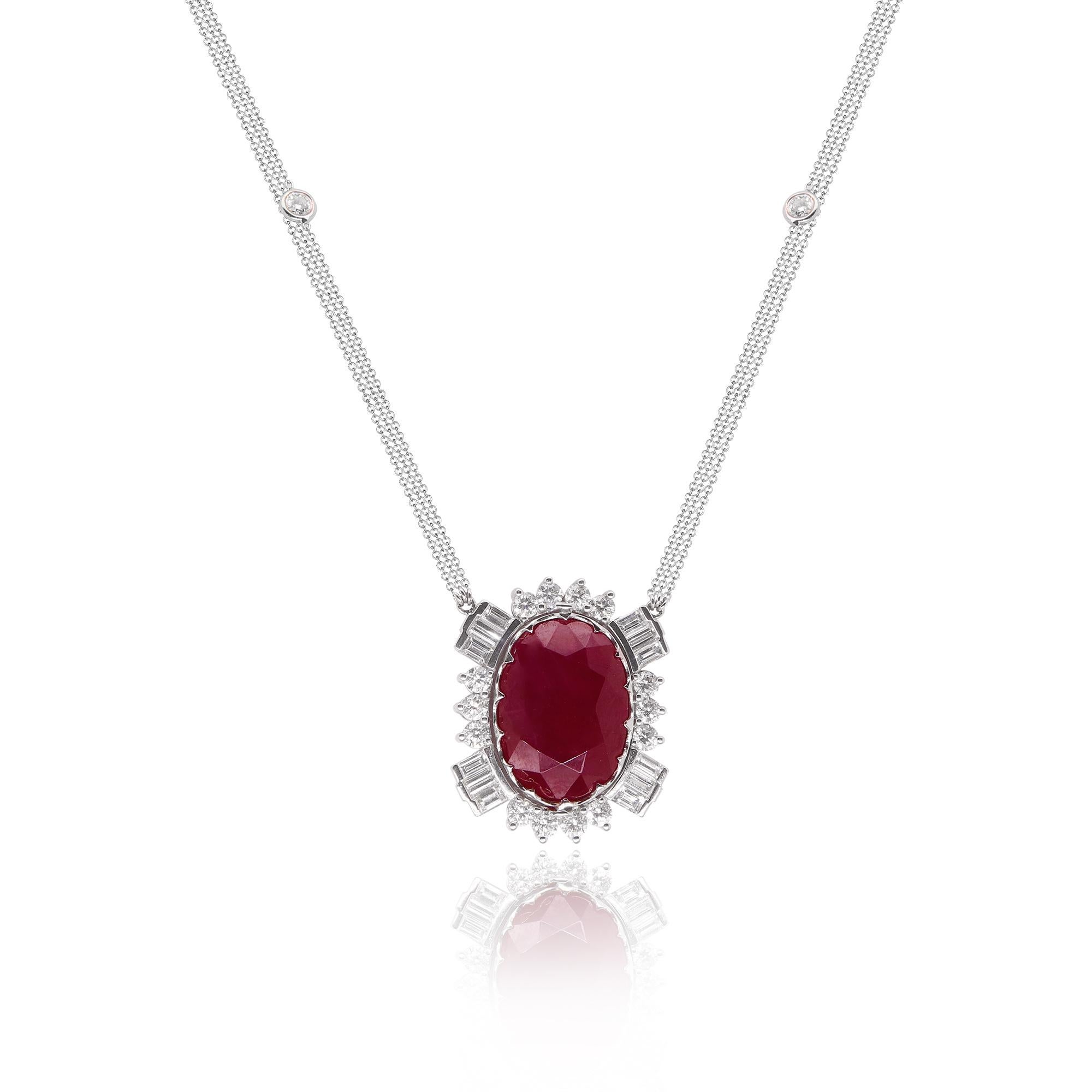 Material: 18K White Gold 
Center Stone Details: 1 Oval Shaped Ruby at 22.04 Carats - Measuring 19.88 x 14.25  7.82
Diamond Details: 12 Baguette White Diamonds at 1.4 Carats - Clarity: VS-SI / Color: G-H
Diamond Details: 20 Brilliant Round White