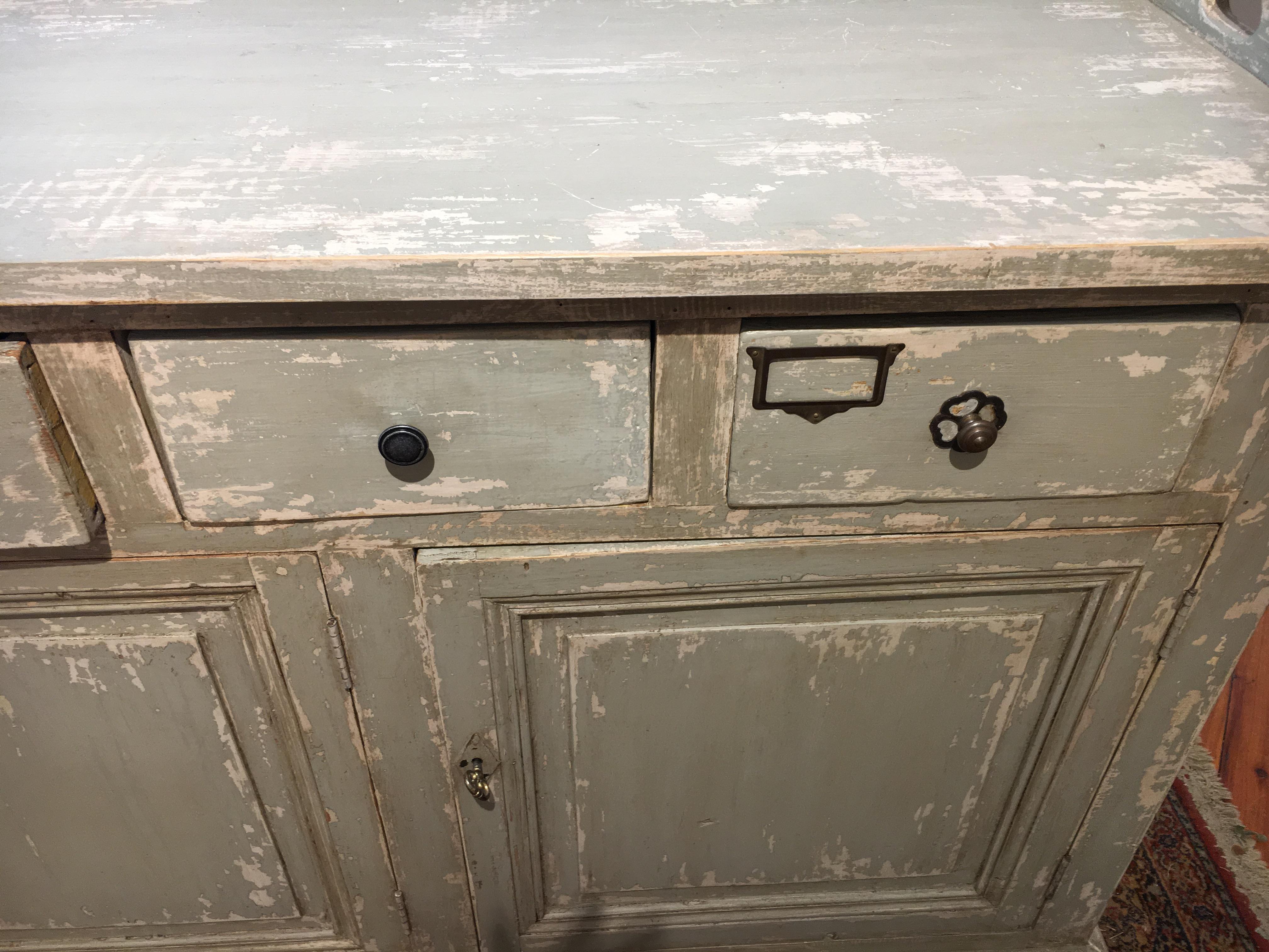 Wood circa 1870 we buy more store counters than anything in the store and this piece, from a French restaurant in the south of France, is as special as any piece we have found in the last 3 years. There are 3 doors and 5 drawers on this piece. The 3