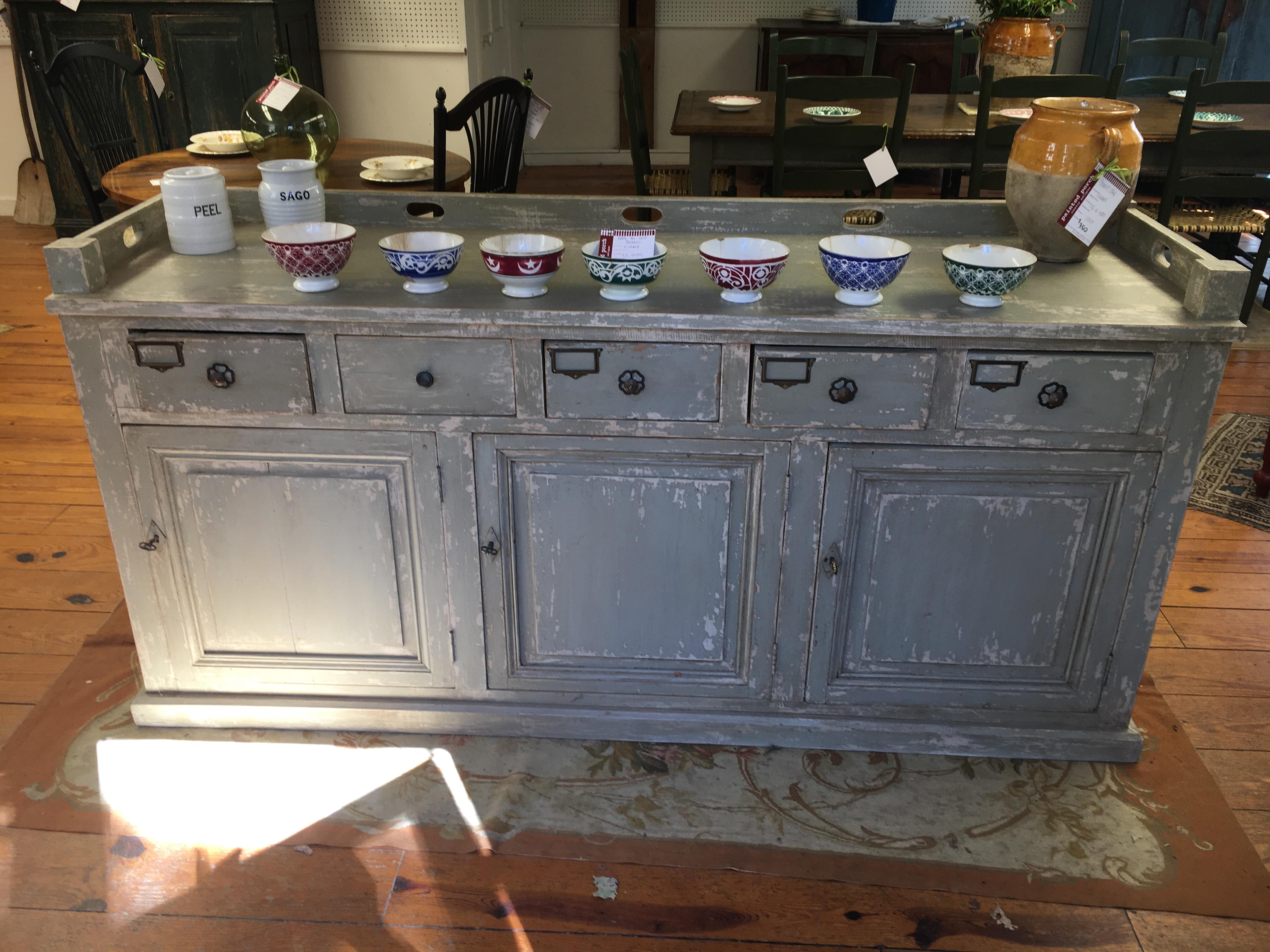 We buy more store counters than anything in the store and this piece, from a French restaurant in the south of France,is as special as any piece we have found in the last 3 years. There are 3 doors and 5 drawers on this piece. The 3 doors are on