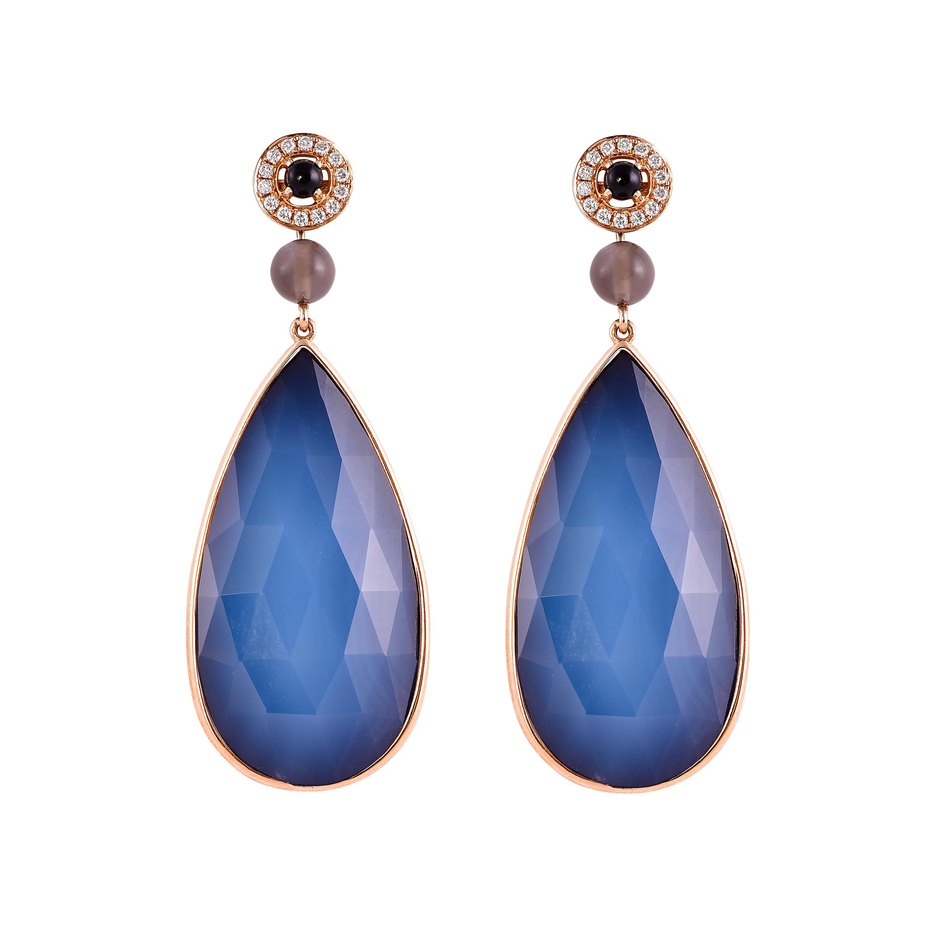  The earrings are two-sided and you can easily turn them as your heart desires! Featuring an exotic and unique cut pear cabochon, these earrings are easy to wear and showcase beautiful opaque gemstones accented with pearls and diamonds. 

White &