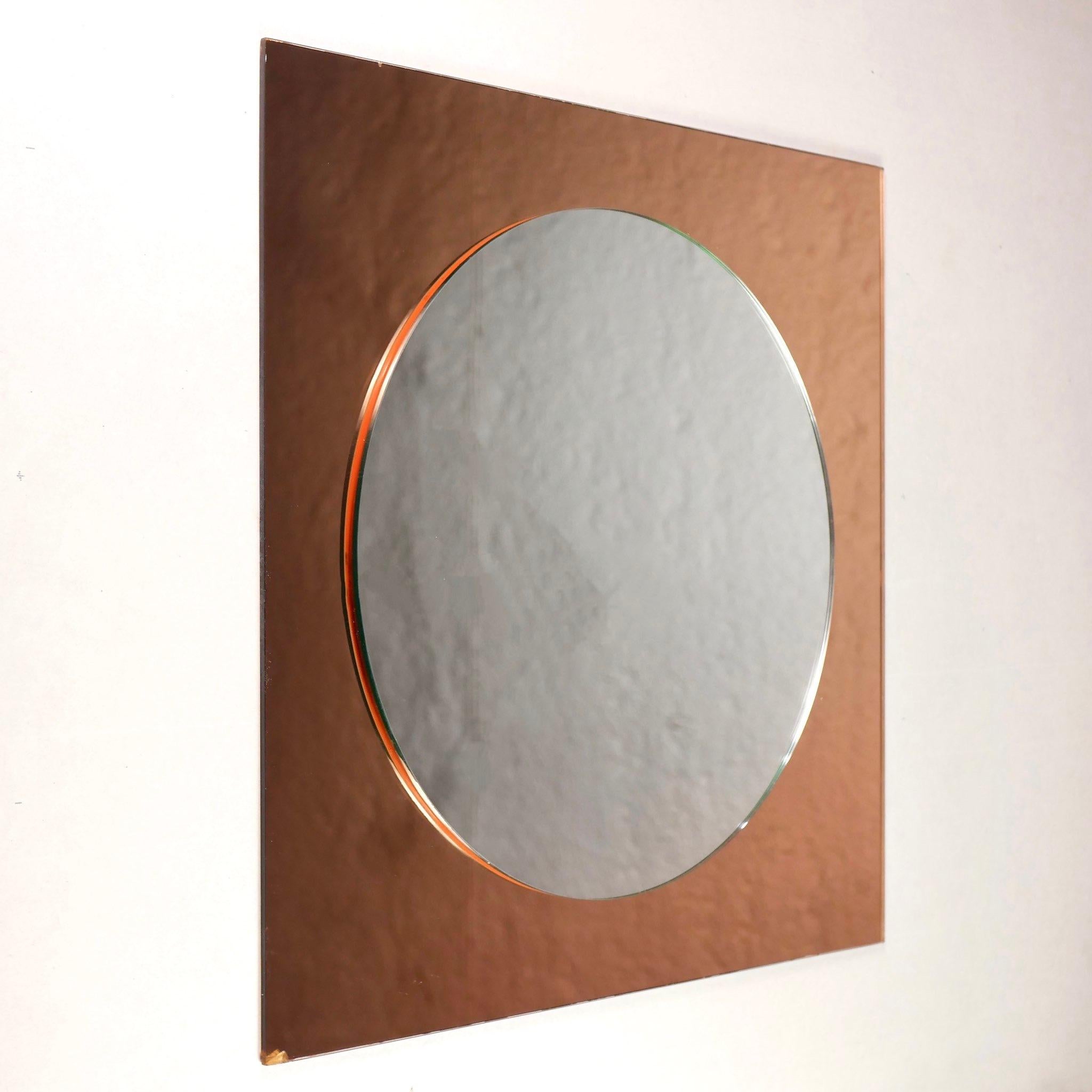 A circle within a square.
Splendid two silverings square shape mirror from France, 1980s.
First silvering in circle is neutral silver, second silvering in square is pinky.
To be placed on a piece of furniture, or hanged to the wall (fastenings