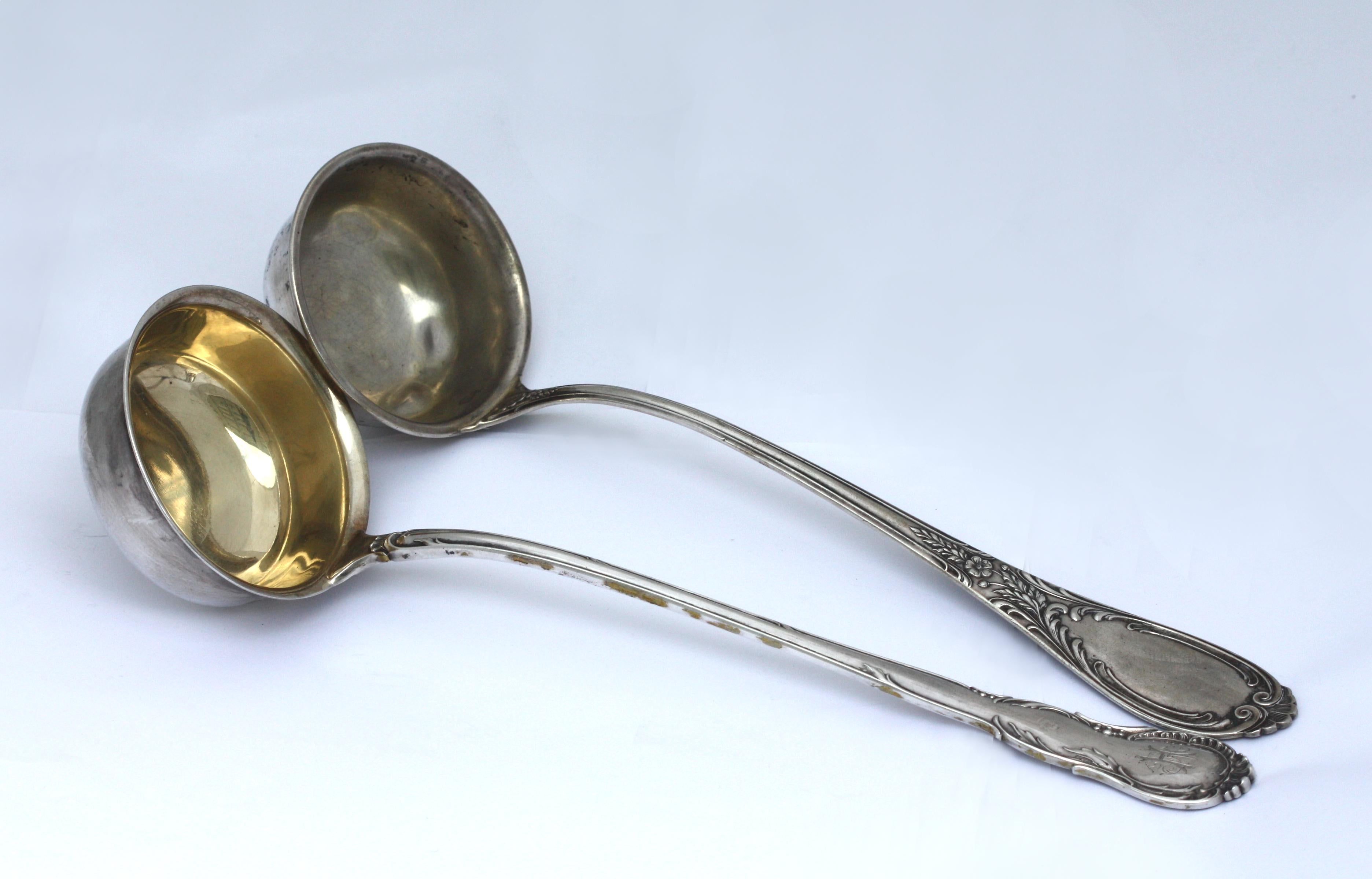 
Two Similar Continental Silver Soup Ladles
One marked 800, other marks worn, the second, marked A.C.T. SCHIENT SCMY 800, with two further indistinct marks. Both chased with foliate scrolls, one monogrammed.
Length 13.25 in. (33.65 cm.), 18.6