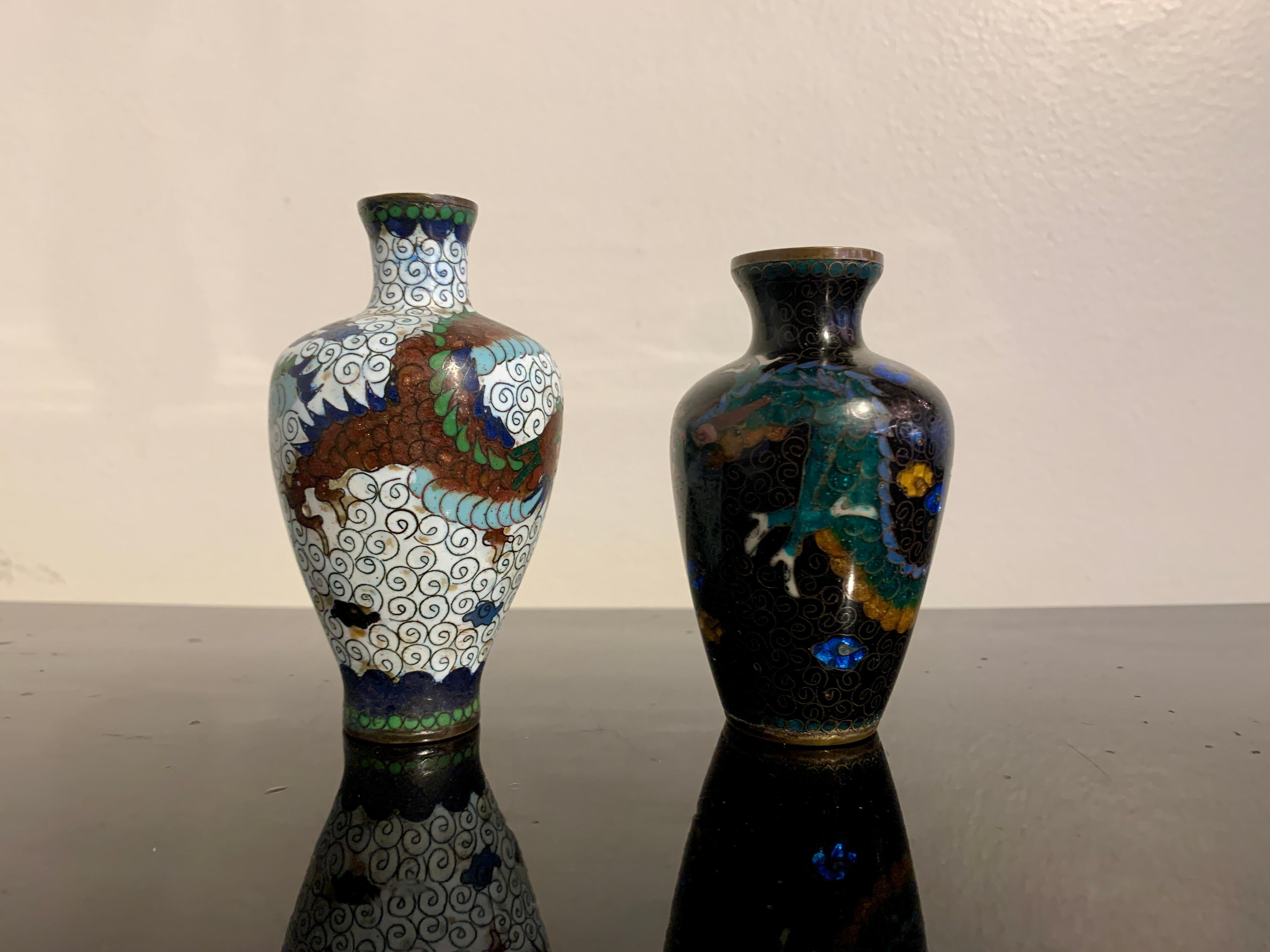 Two charming, small Japanese cloisonné dragon vases, Meiji to Taisho period, early 20th century, Japan. 

The miniature vases of baluster form, with tapering ovoid bodies, high shoulders, short necks, and slightly everted mouths. The small vases