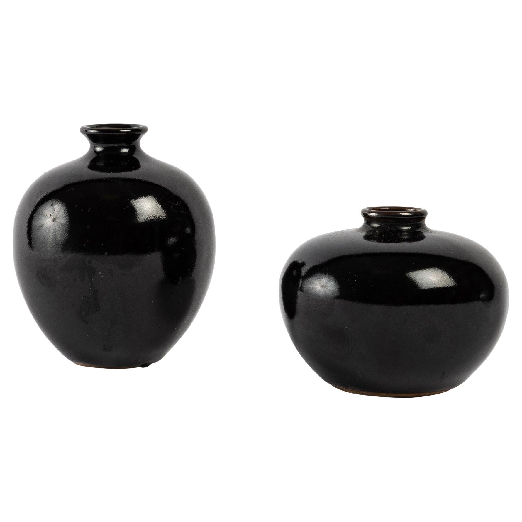 Two Small Mirror Black Enamelled Vases