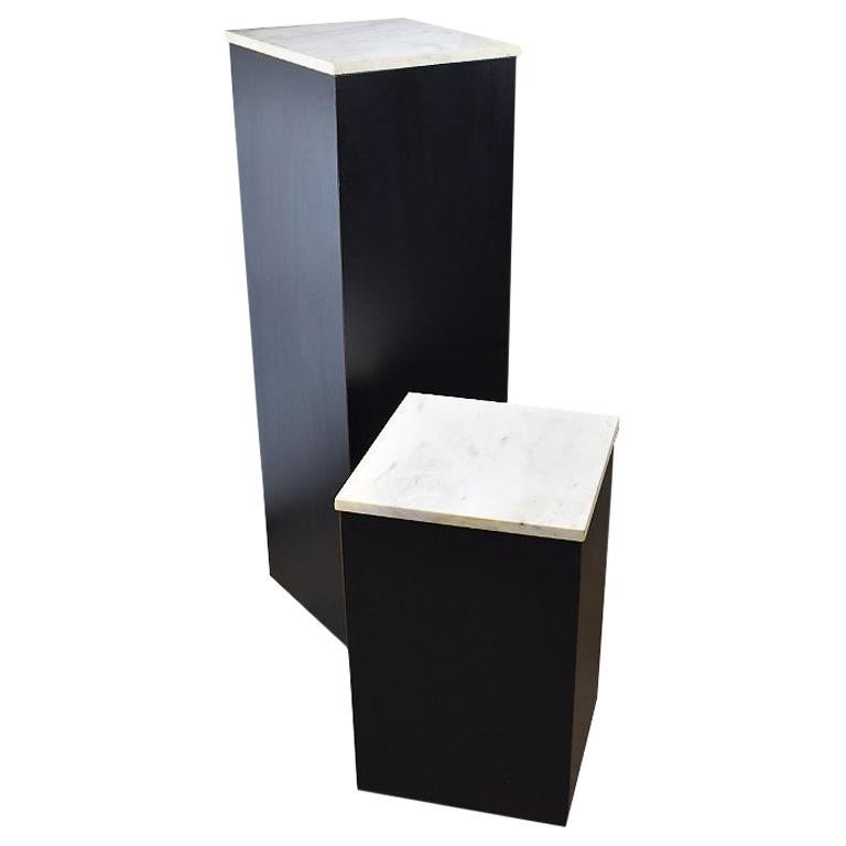 Two Square Black Marble and Wood Plinth Pedestals with Marble Tops, a Pair