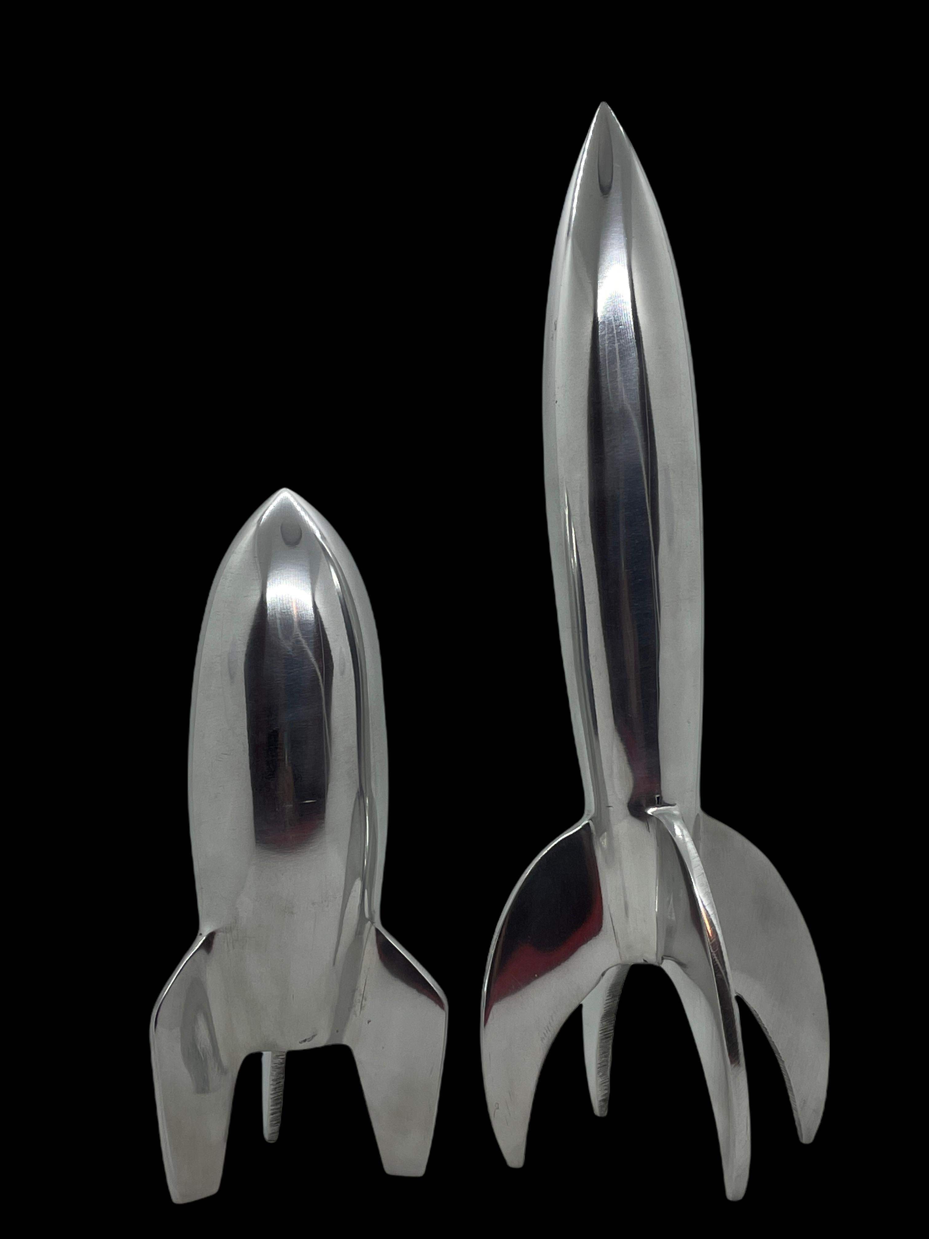 Scaled model of two Rocket statues. Hand-spun in metal. A nice architectural sculpture for every living room or desktop. Tallest measures approximate 11.5