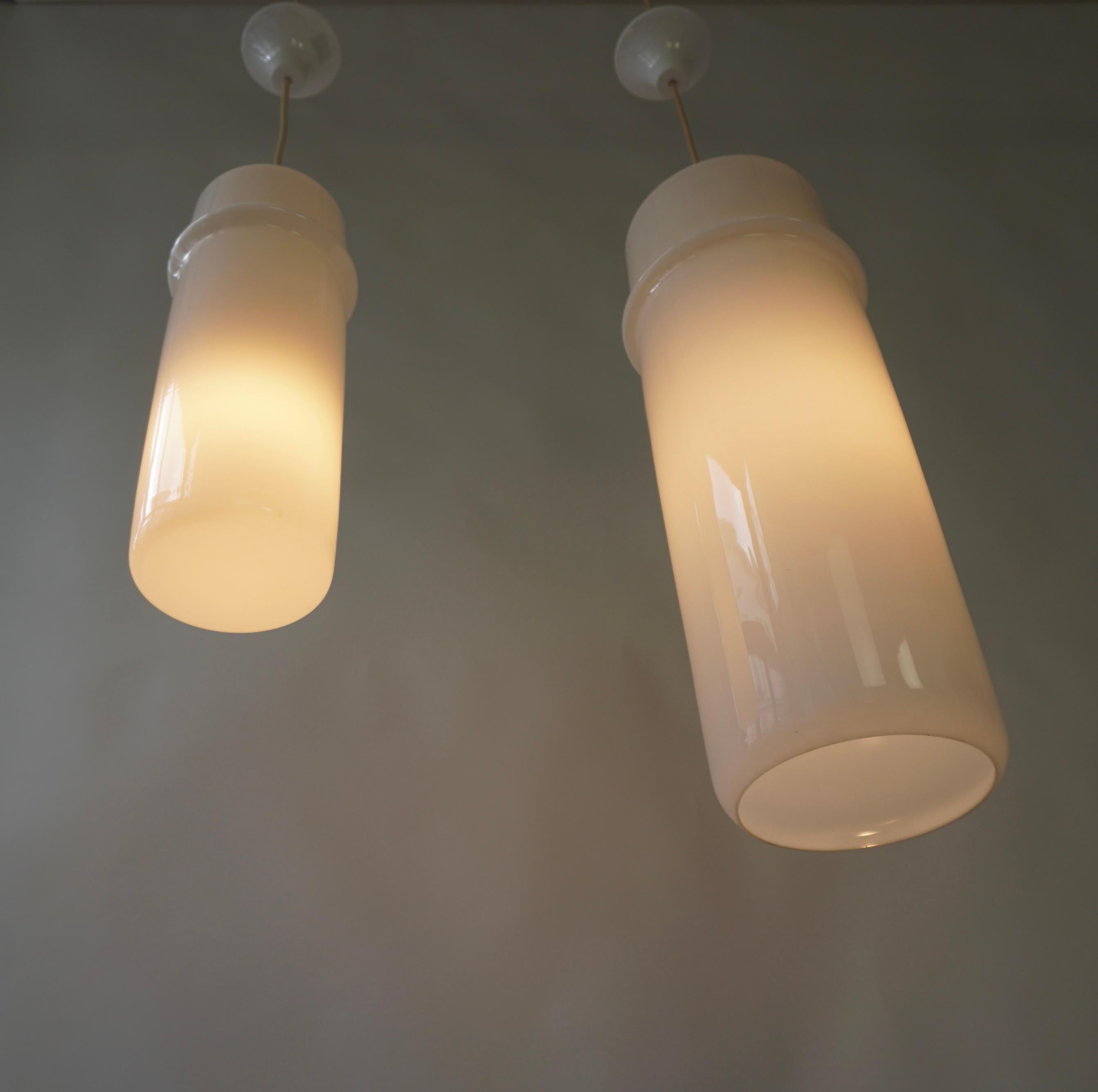Metal Two Stilnovo Pendant Lamps in Murano Glass and Brass, Italy, 1960s. For Sale