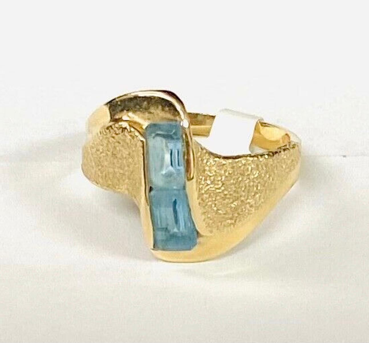 14k yellow gold 2 stone aquamarine ring. The dimensions of the two aquamarines are approximately 5.5mm x 4 mm each. Each stone approximately 1/2 carat for a total of 1 CTW.
Marked 14k. Approximate size 7.