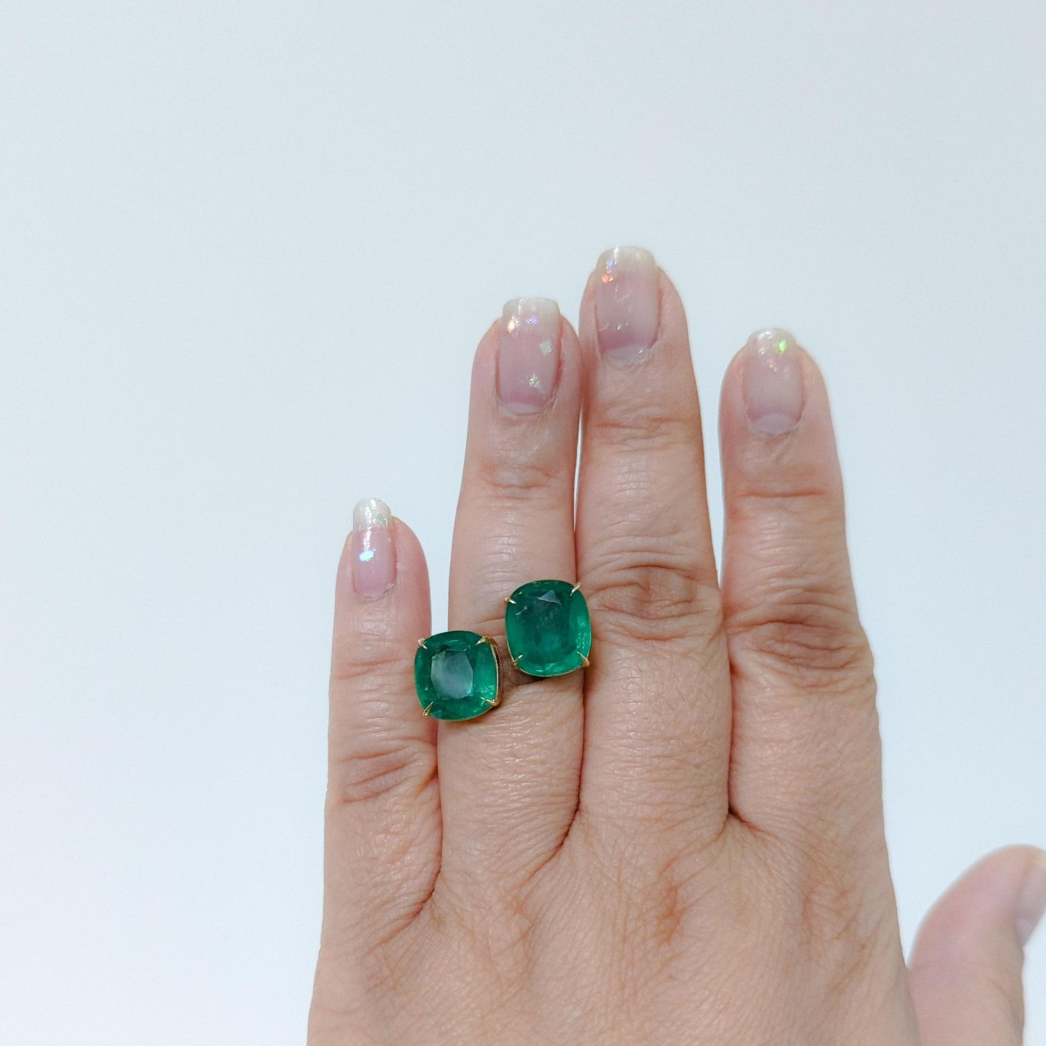 Gorgeous 11.87 ct. bright green emerald cushions in a handmade 18k yellow gold mounting.  Ring size 6.5.