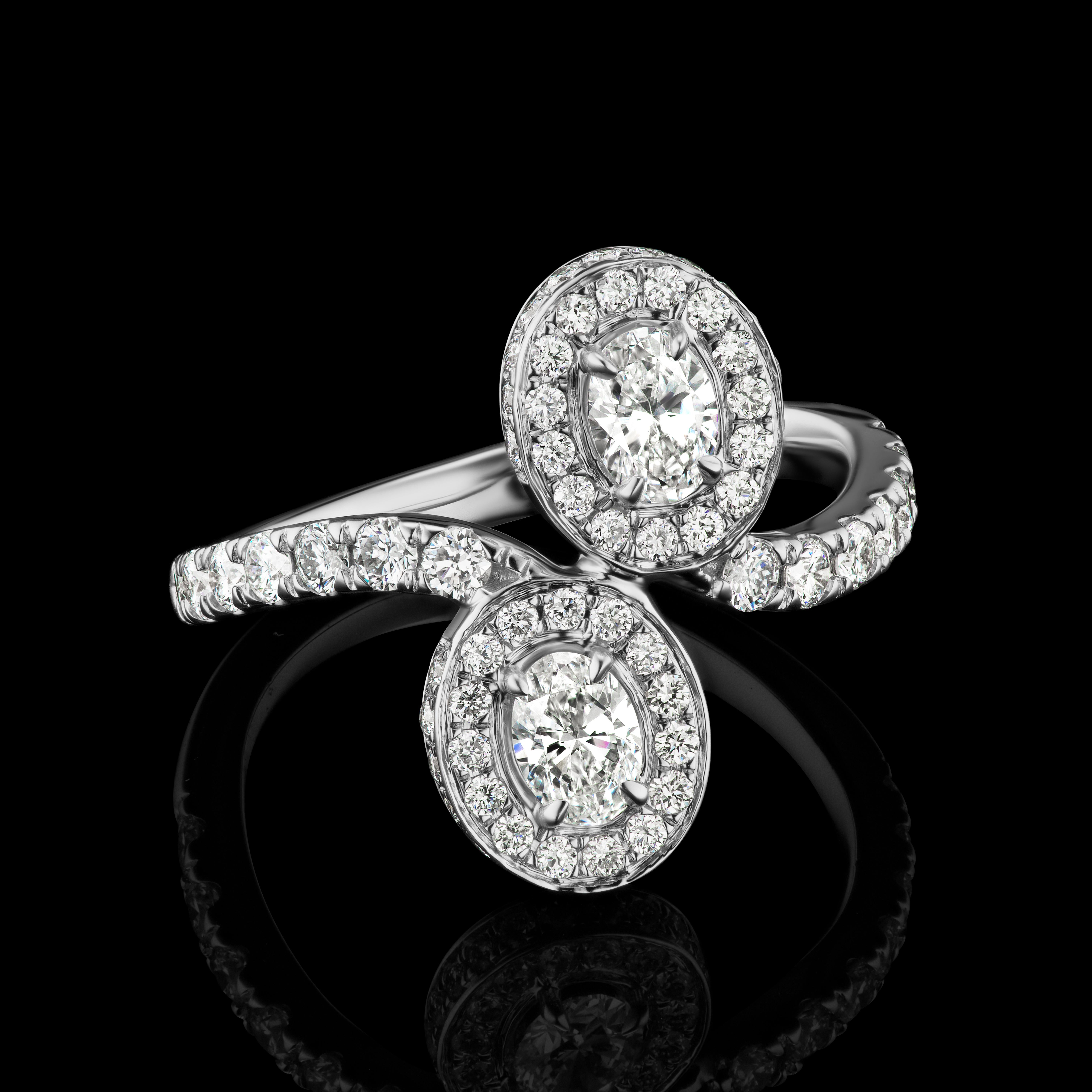 Forever Us Oval Diamond Ring in 18K White Gold ( 1.37 ct. tw. )

Classic and elegant, this ring made with two matching oval diamonds symbolizes love in a perfectly delicate all around pave diamond halo. The shank is also embellished with pave