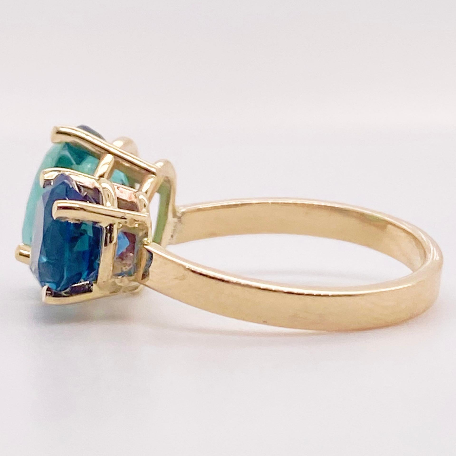 This two stone ring has natural, genuine gemstones that were hand selected by our top Gemologist. The beauty of the luscious green tourmaline that was mined in Brazil has a gorgeous, rich color. For blue gemstones, the blue zircon has the most