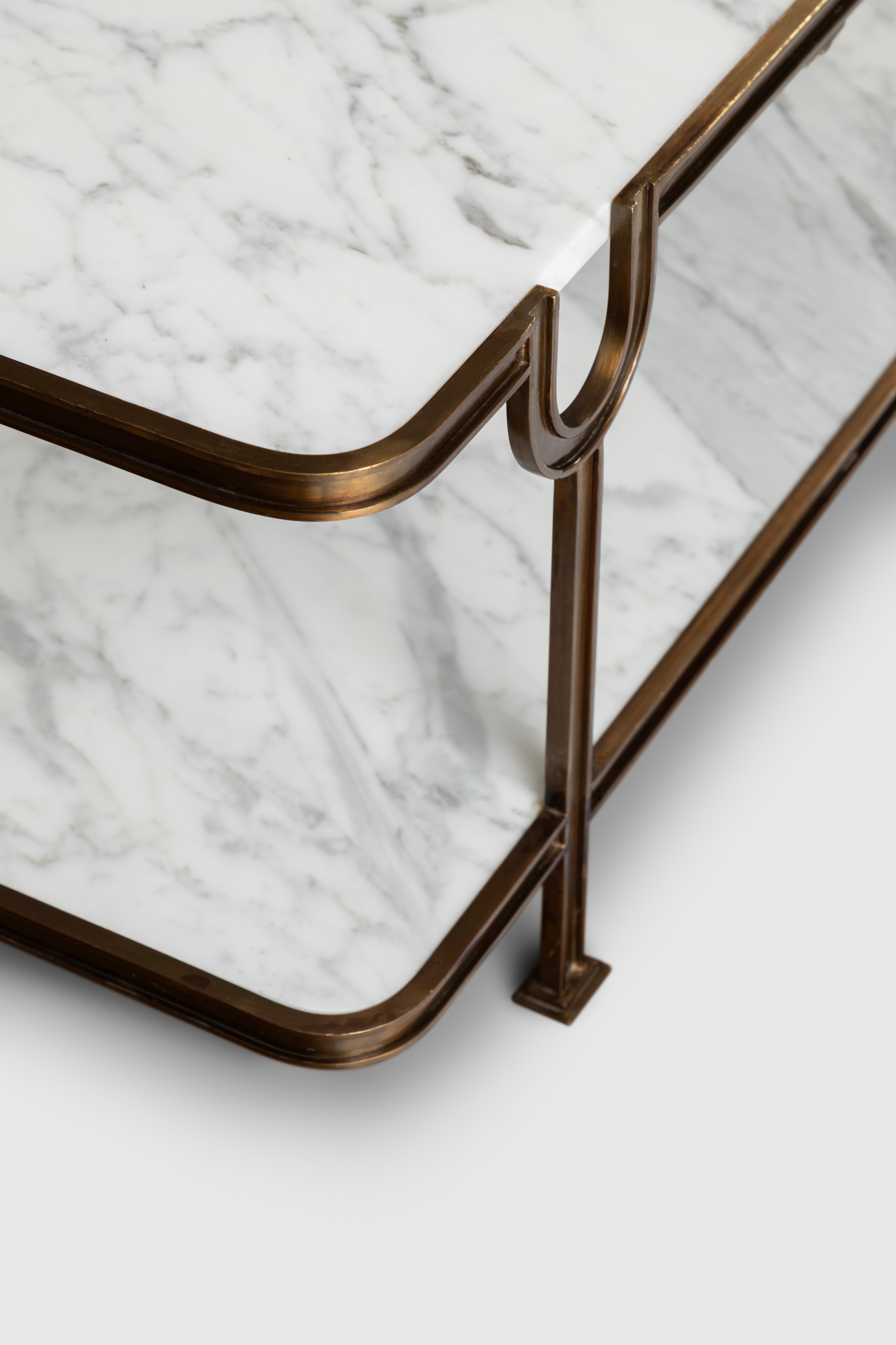The Vendôme coffee table is made out of bronze and two thick marble covers. It represents our passion for forged bronze and work. It takes a lot of time and effort for the artisans to create the delicate borders and shapes of this design. In order