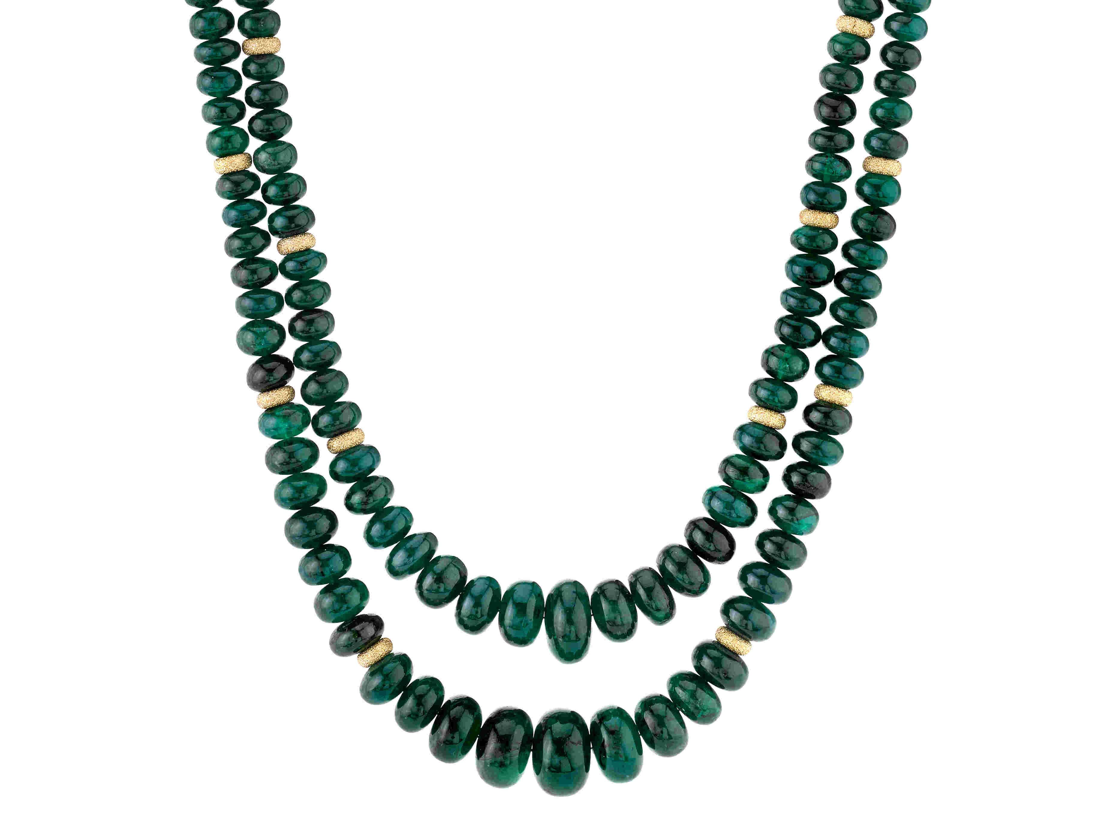 This double strand of emerald beads is stunning! The emerald beads possess both rich color and vibrancy, and are well-matched for color and translucence. Hand strung with 14k yellow gold spacers, this necklace is very versatile; a piece you can wear