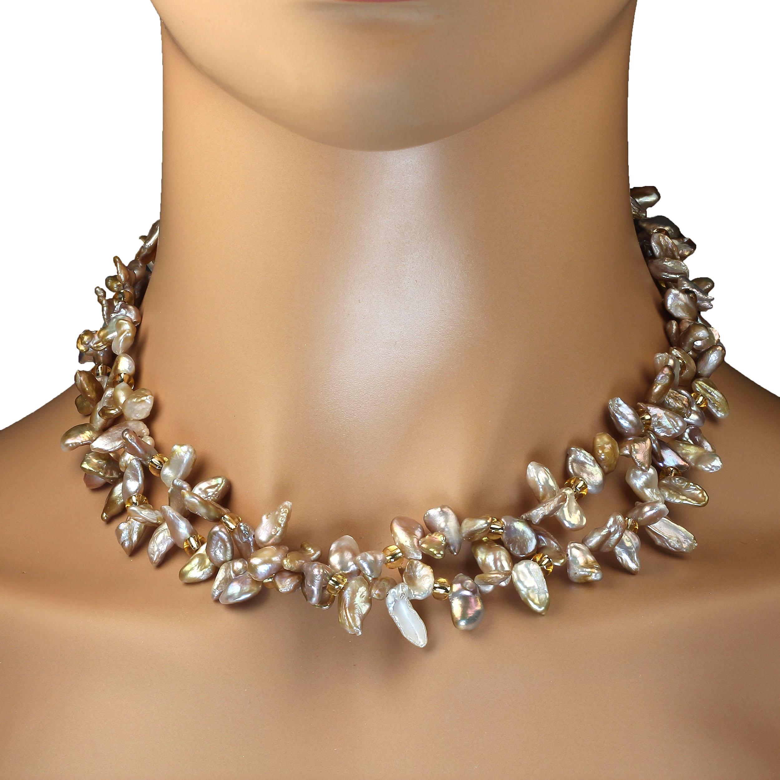'Put on your Pearls Girls' Lulu Guinness
Unique 17 inch necklace of two strands of free form Pearls in lustrous shades of goldy-gray. These Chinese freshwater pearls are approximately 10 x 5 MM and accented with gold Czech beads. The necklace could