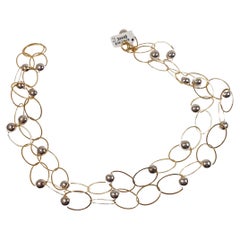 Two-Strand Necklace in Yellow Gold with White Gold Balls