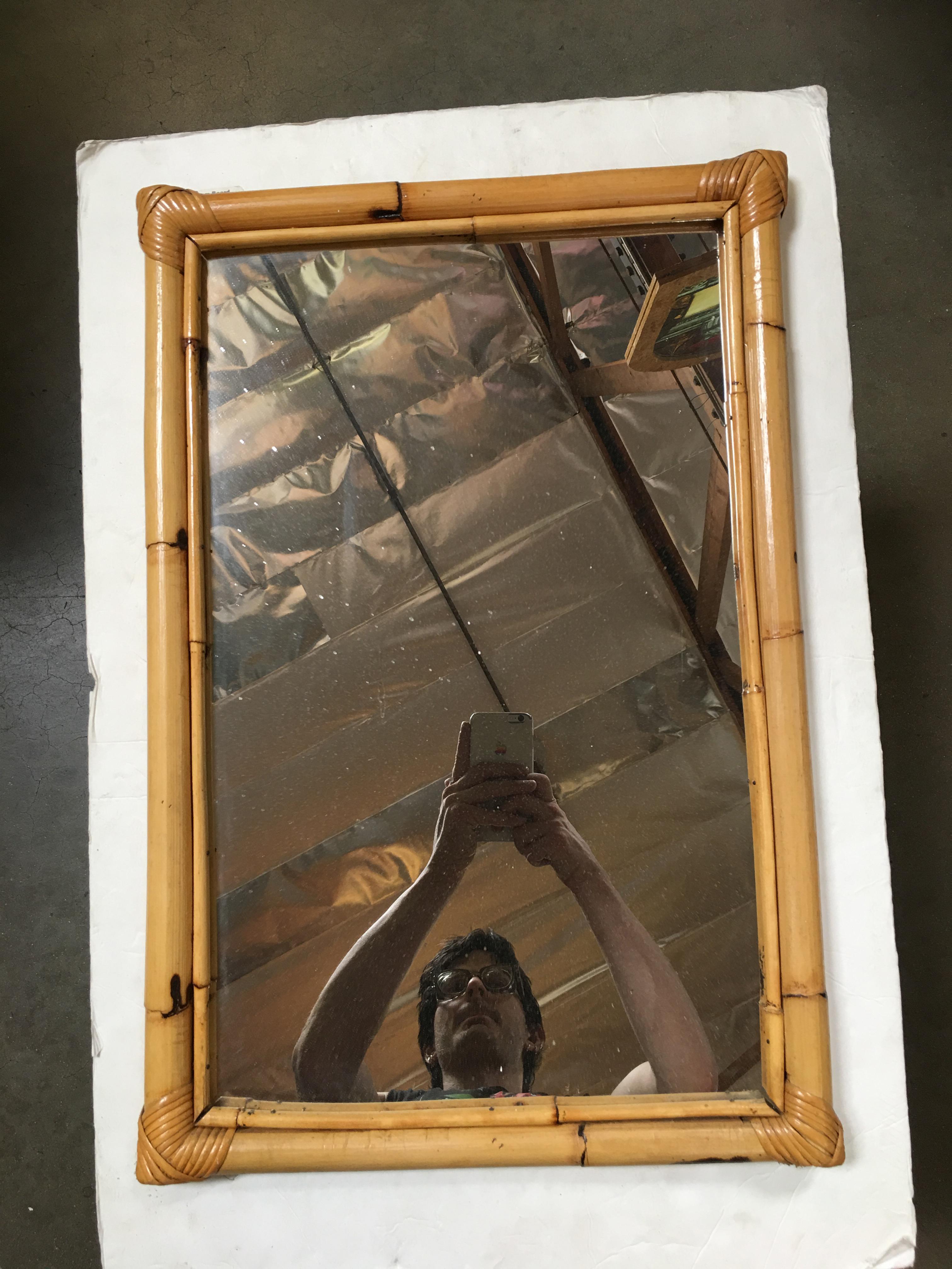Large rectangular mirror featuring a single-strand Rattan frame with an inner stick rattan border. 

Restored to new for you. 

We only purchase and sell only the best and finest rattan furniture made by the best and most well-known American