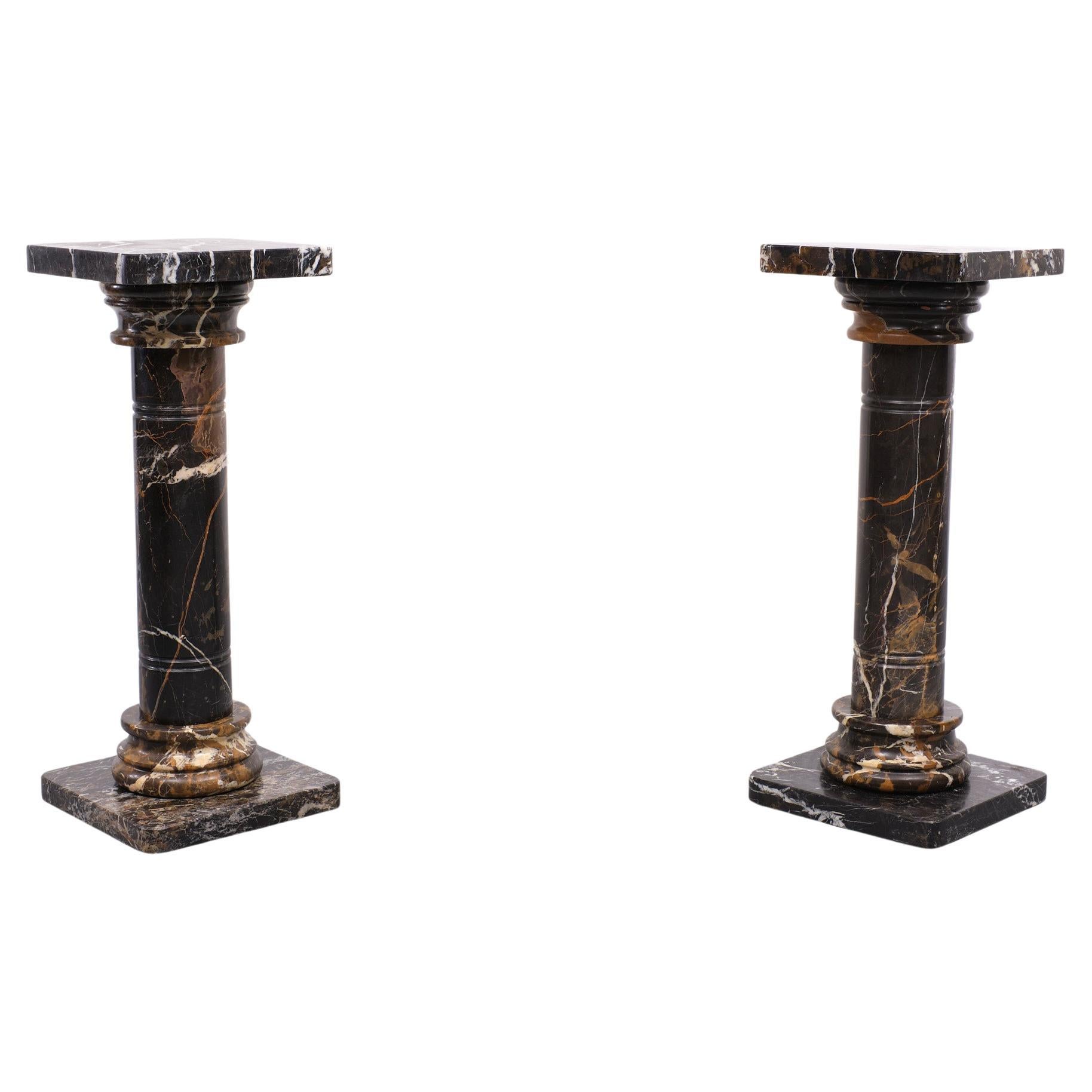 Stunning set Pedestals executed in portoro marble. So full of live and color.
Art Deco Portoro Marble or Marmo di Portovenere? It is quarried in the Gulf of La Spezia (Liguria), Italy 
The Portoro is a fine-grained, black marble with gold veining