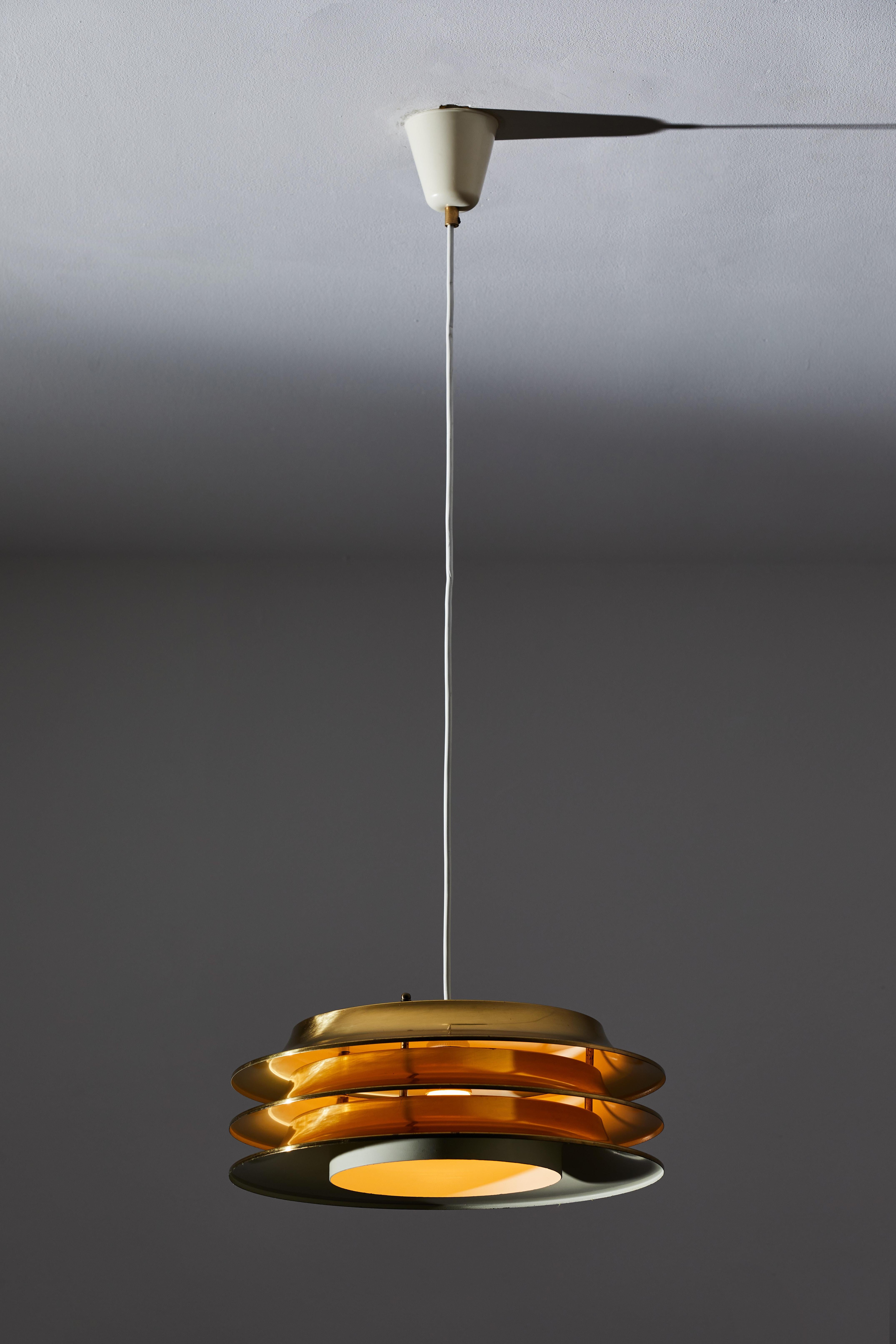 Two suspension lights by Kai Ruokonen for Lynx Edition. Designed and manufactured in Finland, circa 1960s. Brass, enameled brass. Rewired for U.S. junction boxes. One has a black canopy, one has a white canopy. Each light takes one E27 60w maximum