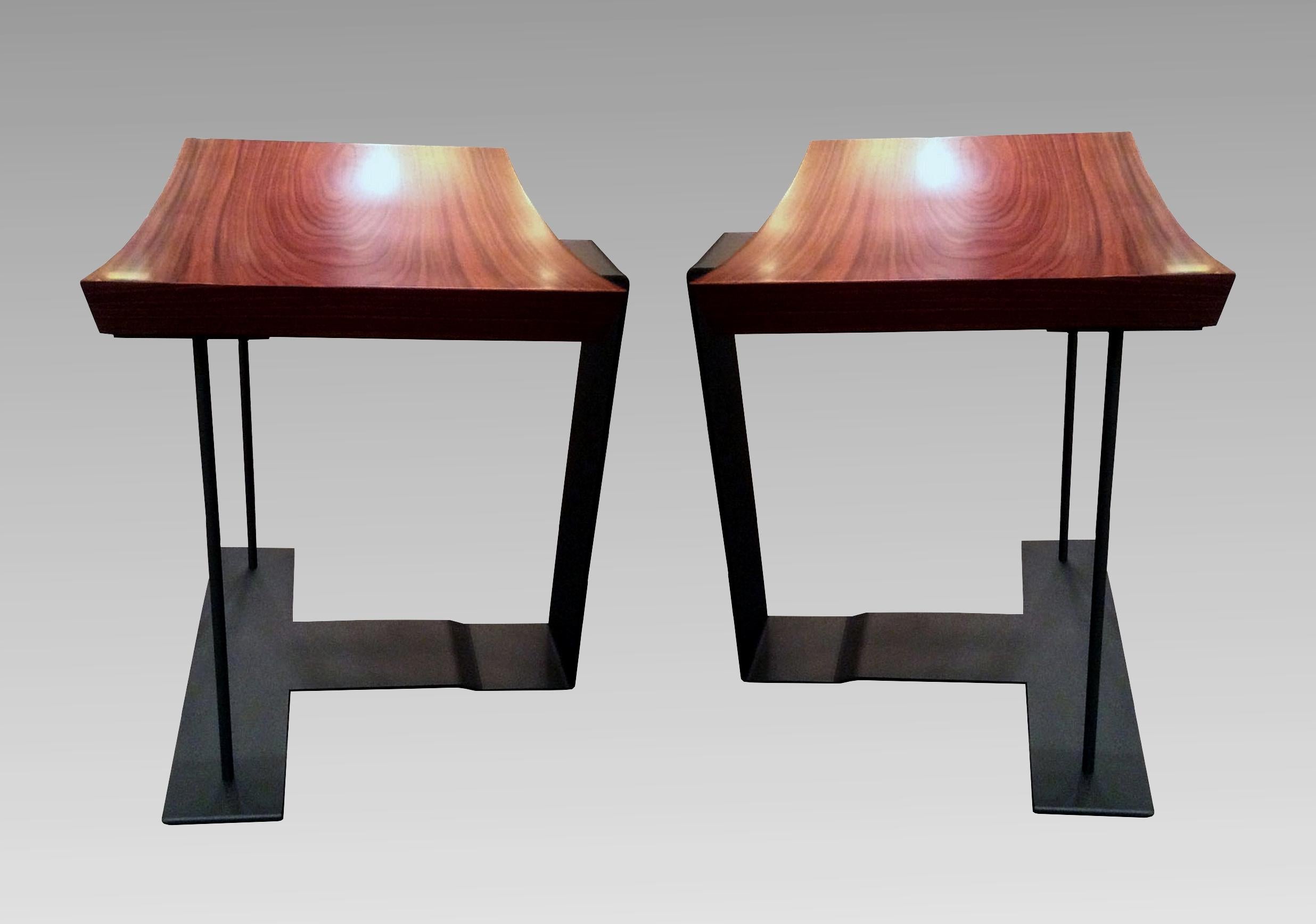 Two end of 20th century stools, model « T 1927 », by Pierre Chareau edited by Ecart International; stamped under seating.
Base in gray painted steel, rosewood veneered top.
