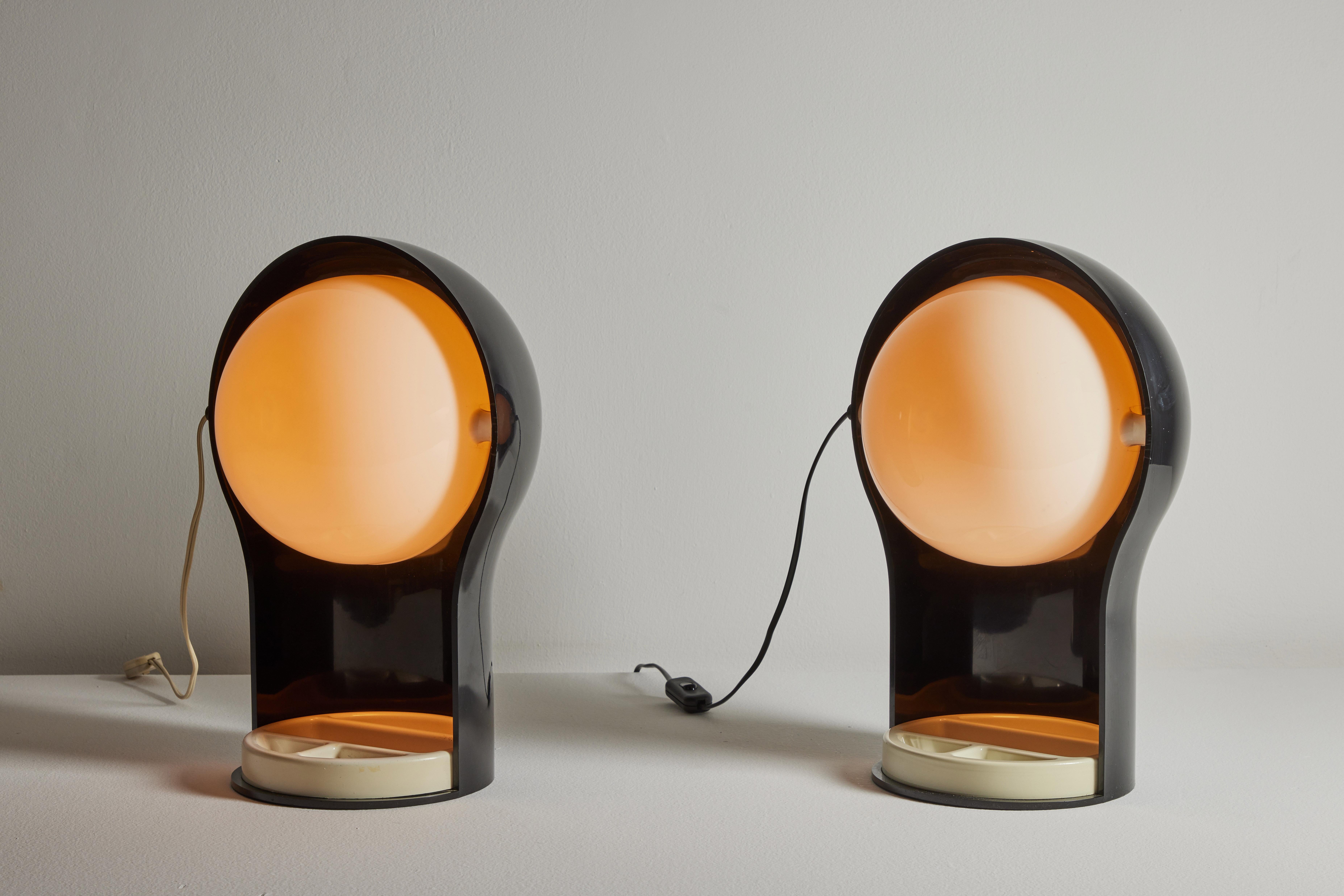 Two table lamps by Vico Magistretti for Artemide. Designed and manufactured in Italy, 1968. Enameled metal, perspex. Original European cord. U.S. adaptor provided. Rewiring with U.S. cord for additional fee and lead time. We recommend one E14 60w