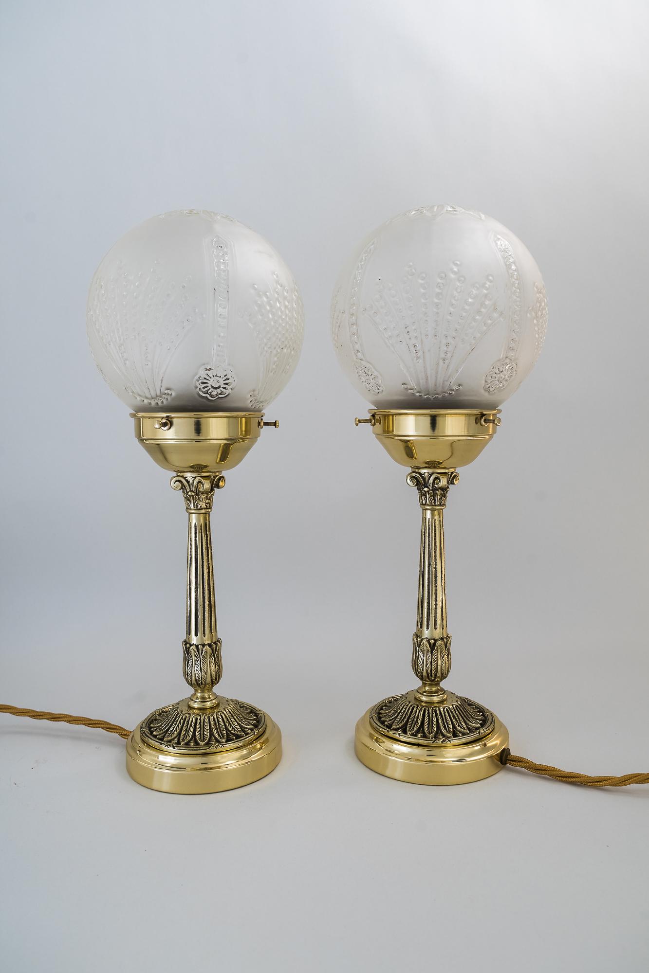 Two table lamps, Vienna, circa 1920s
Brass polished and stove enamelled
Original glass.