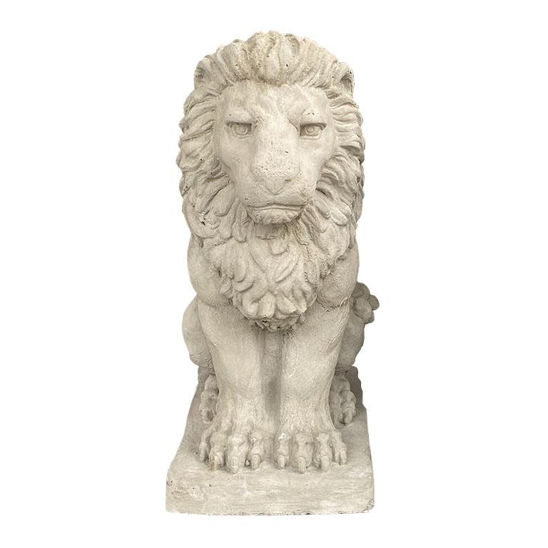 A pair of two concrete stone lions. Such a wonderful way to add a regal look to an entryway. (Or perhaps even a driveway.) Each lion sits on it’s hind legs, with his front paws outstretched and it’s mane flowing down his back. It stands on a small