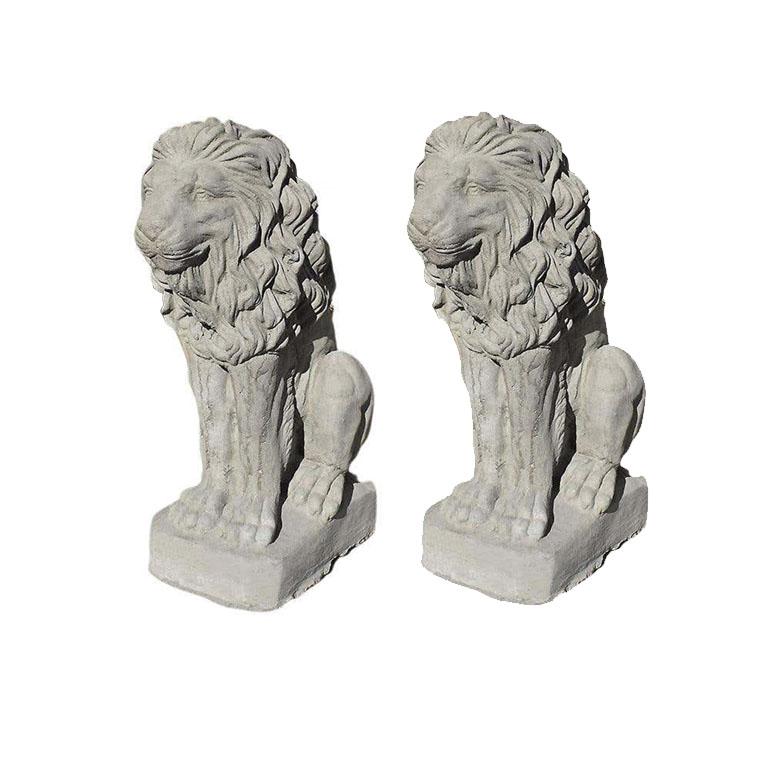 A pair of two concrete stone lions. Such a wonderful way to add a regal look to an entryway. (Or perhaps even a driveway.) Each lion sits on its hind legs, with its front paws outstretched and its mane flowing down its back, and stands on a small