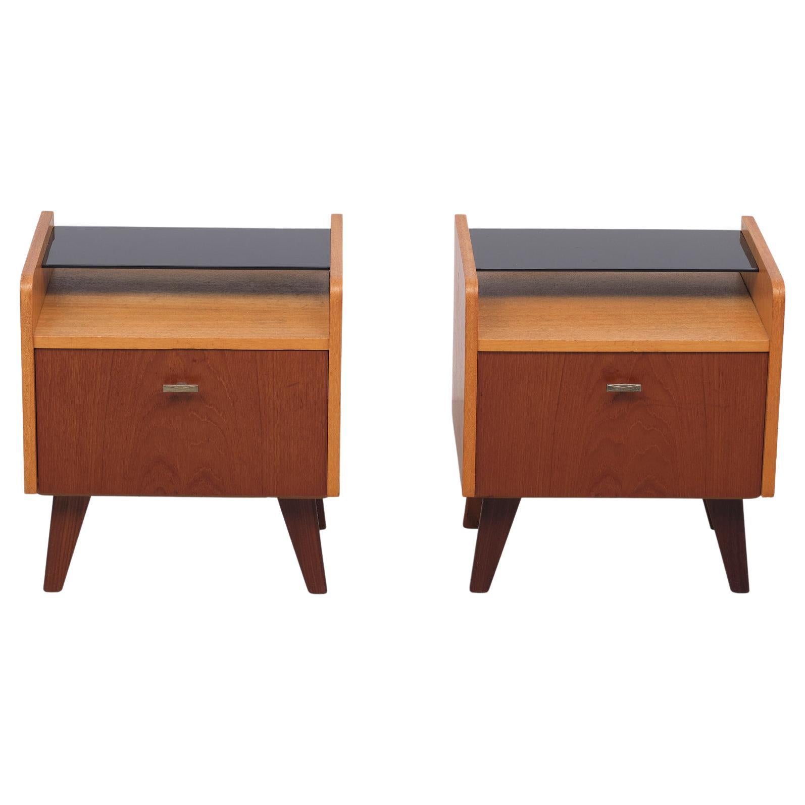 Two Teak nightstands. Comes with there original Black Glass tray.
Good condition. Typical 1960s.