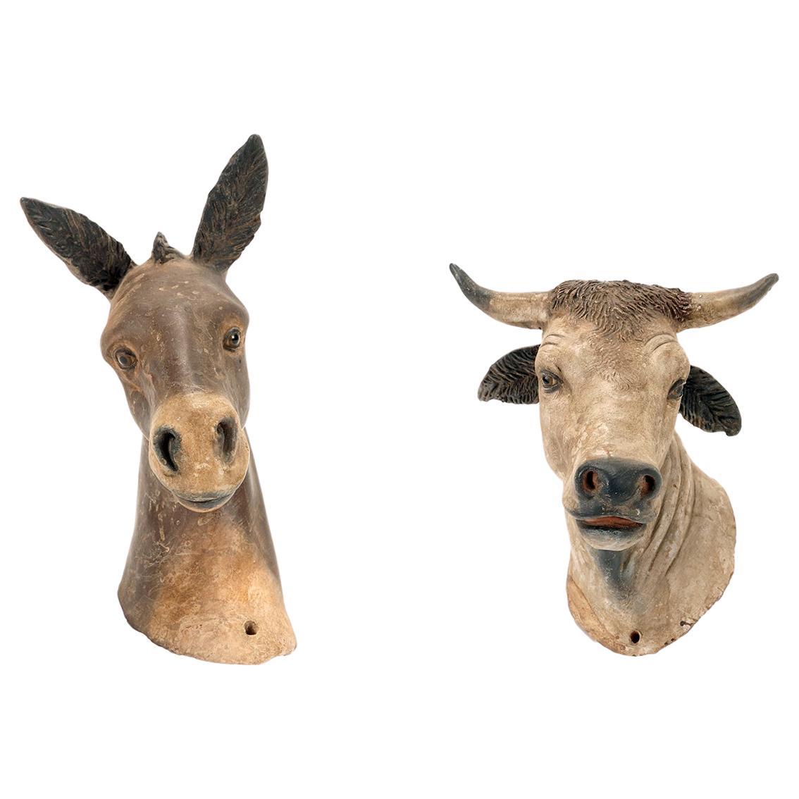 Two terracotta sculptures depicting the ox and the donkey. Italy, 19th century. For Sale