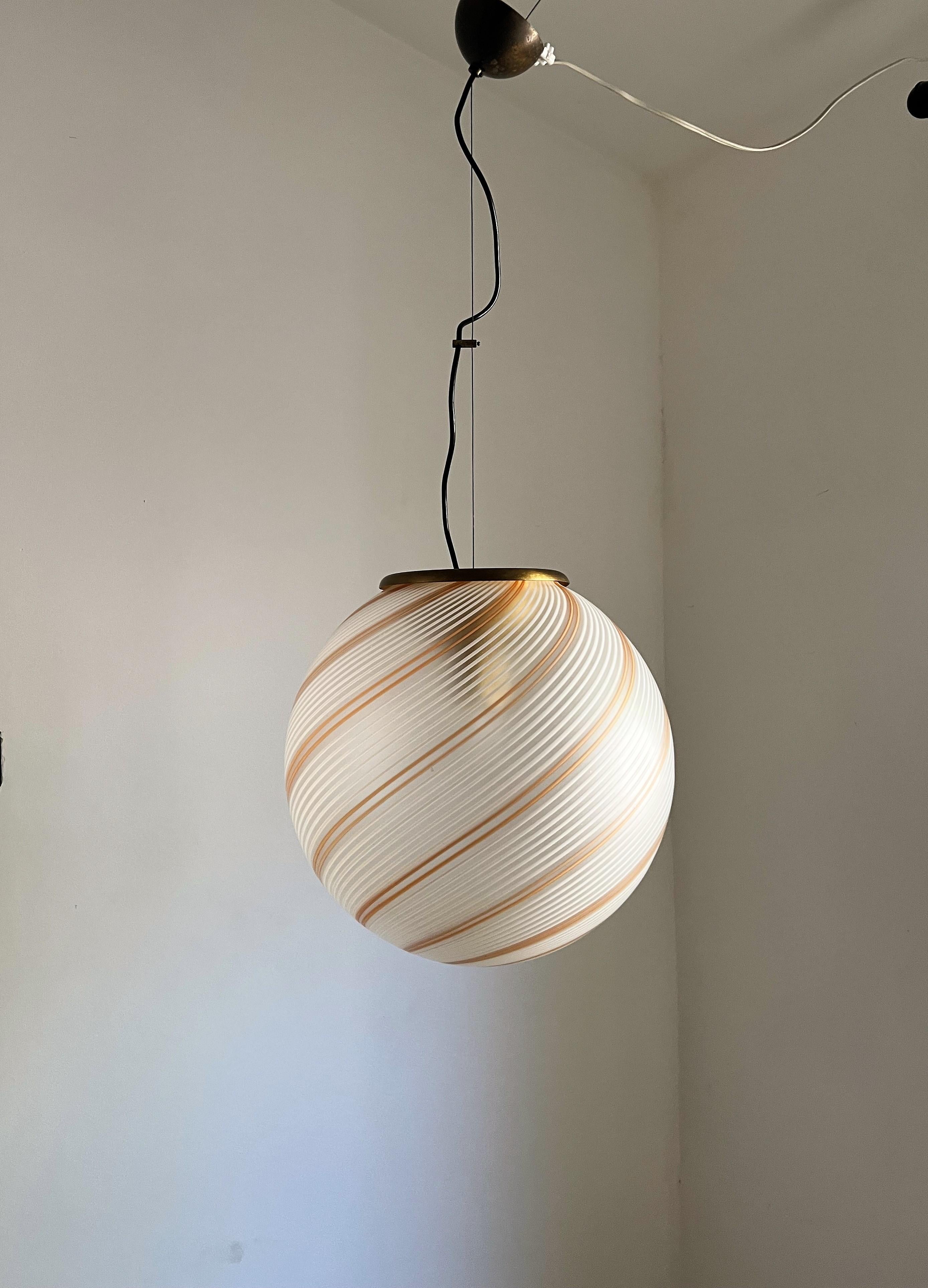 Beautiful and large pendant spheres in white, cream - orange, and clear hand-blown Murano glass in a satin finish, in the style of Venini, circa 1970s
We have 2 identical spheres ( slight variations as they are hand made), Hardware is slightly