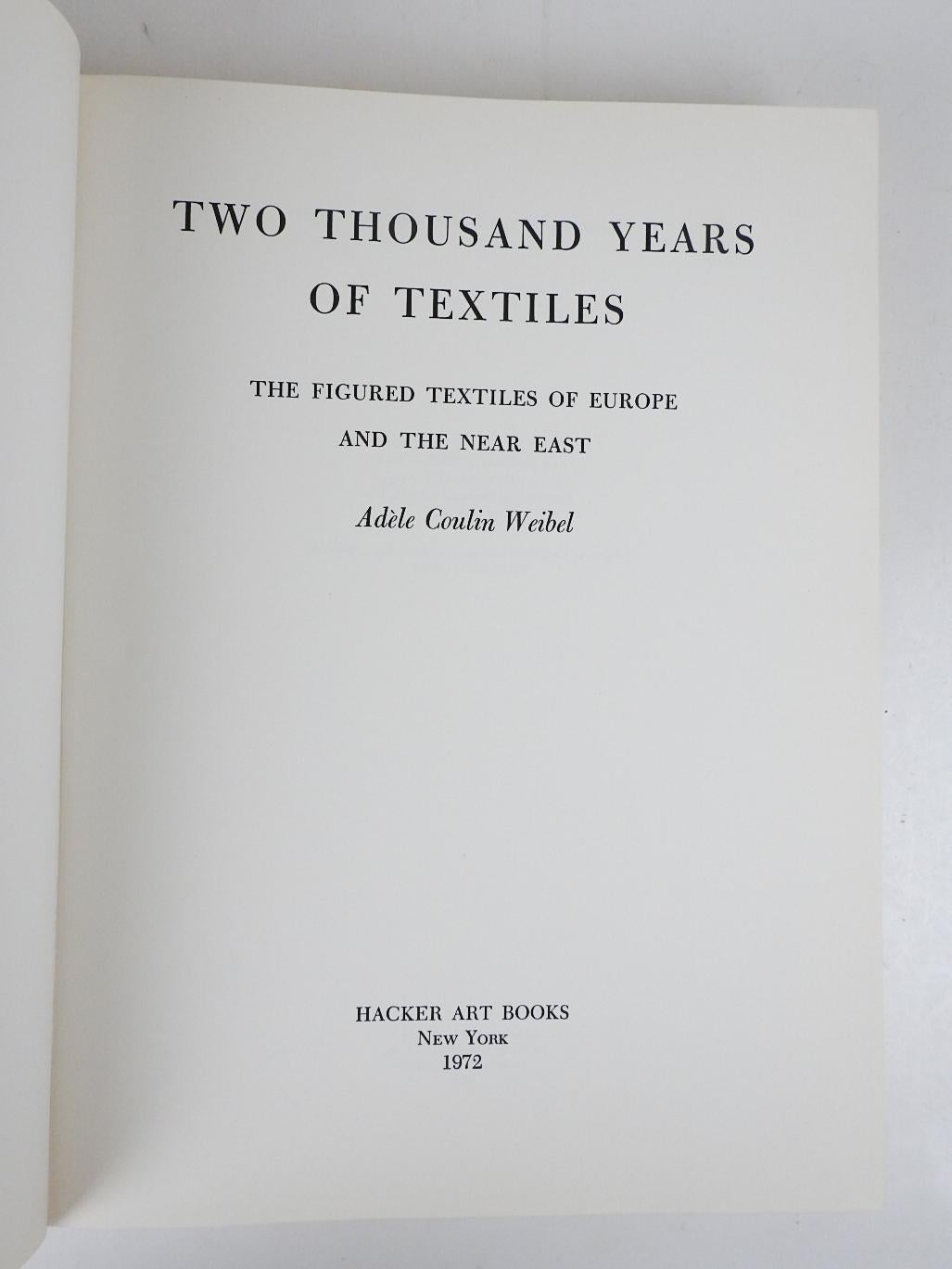 Two Thousand Years of Textiles;: The figured textiles of Europe and the Near East by Adele C. Weibel.  Published by Hacker Art Books, New York, 1972.  Linen cloth binding, many illustrations, minor shelf wear.
