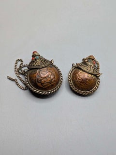 Two Tibetan Copper Snuff Bottles Decorated with Coral, Turquoise and Stone Inlay