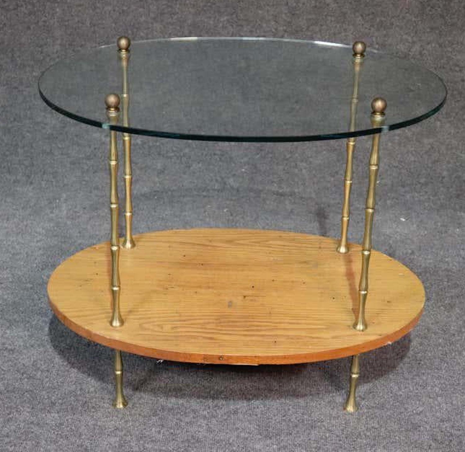 Vintage bamboo style tea cart with round glass shelves.
(Please confirm item location - NY or NJ - with dealer).
   