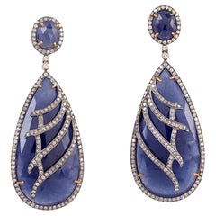 Two Tier Blue Sapphire Dangle Earrings With Diamonds Lines On It