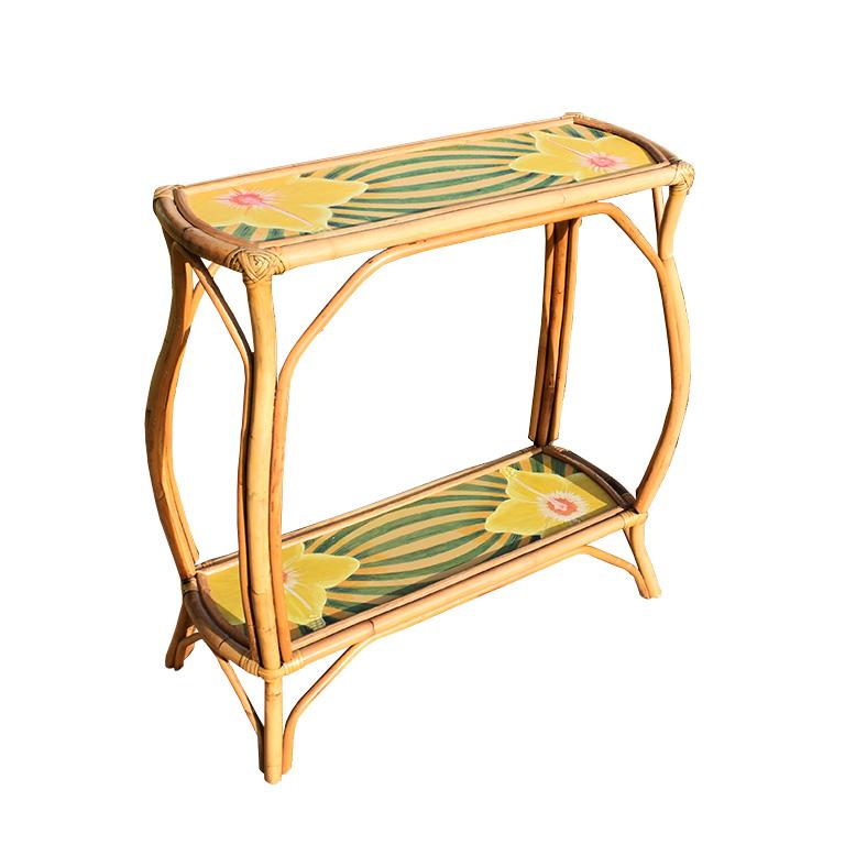 Beautiful two-tier bamboo console table with a dome or bombé style legs. This topical painted bamboo table features two legs, which are in a dome shape or bombé style legs that bulge outward. Both the top and bottom shelves of the piece feature a