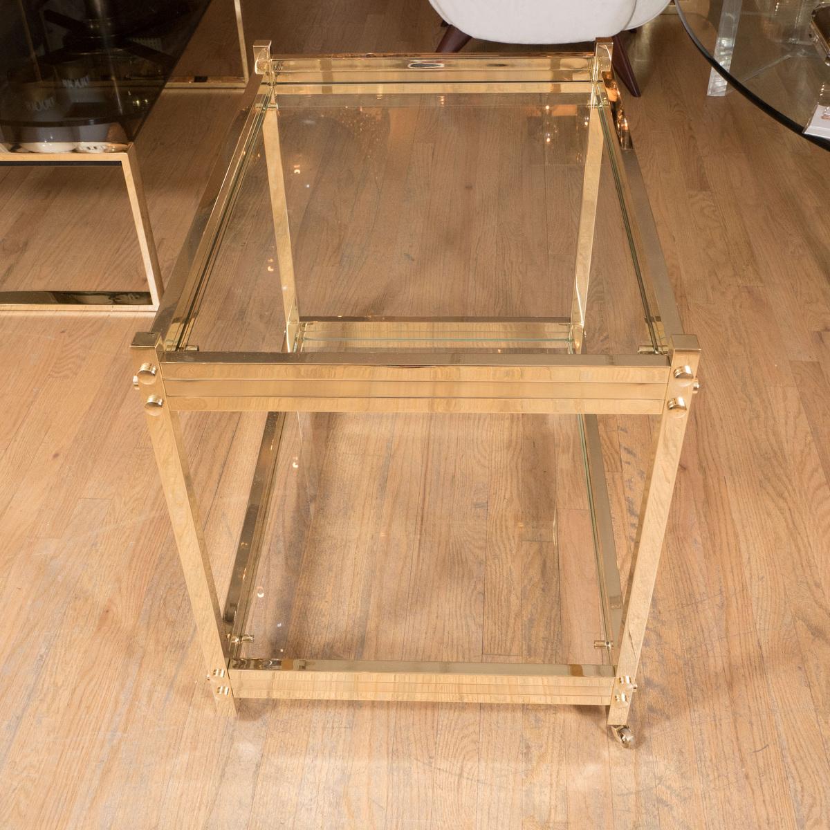 Two tier brass and glass rolling bar cart.