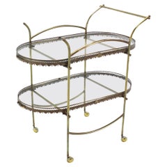 Mesa carrito de dos pisos de latón y cristal con bandejas extraíbles para servir