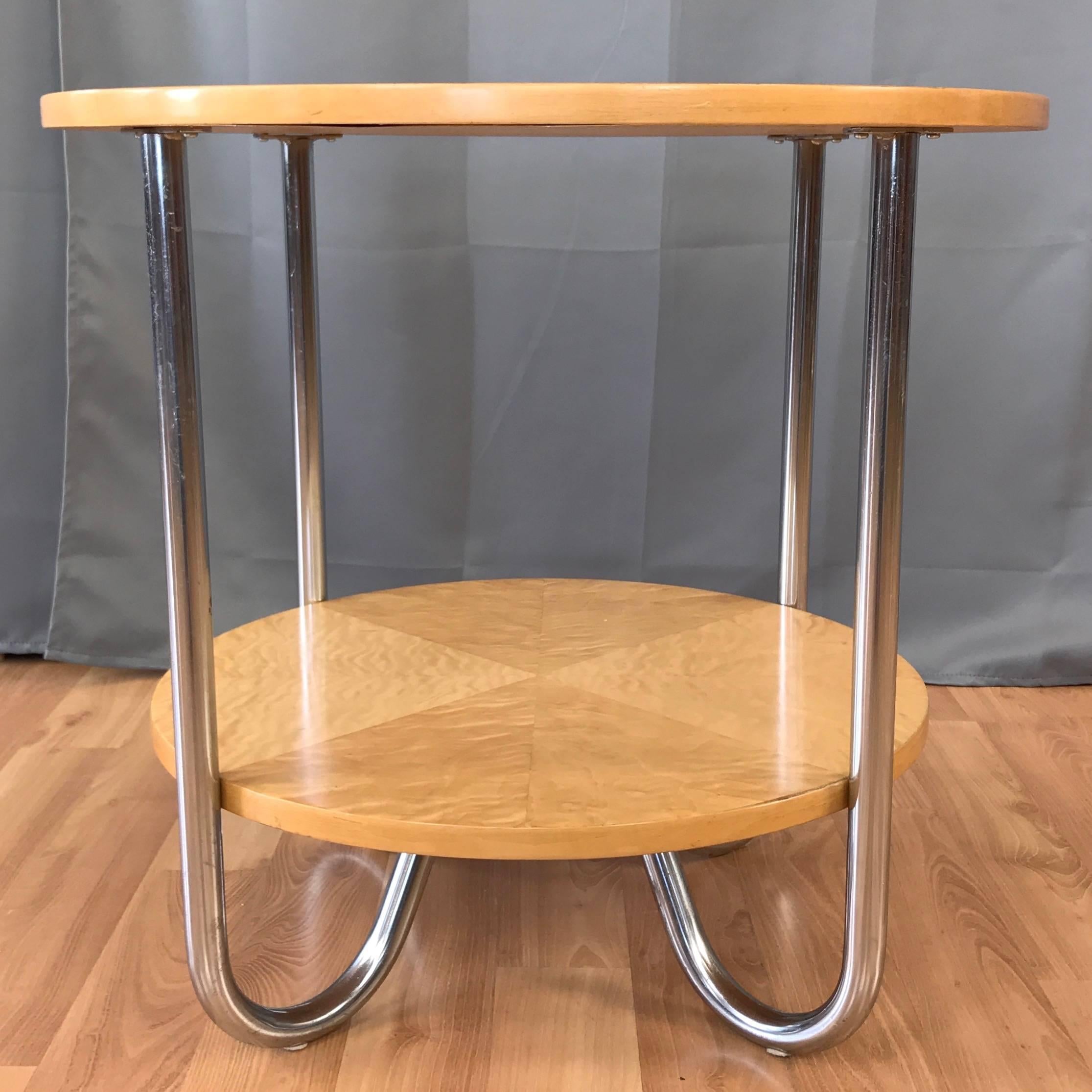 A rare 1930s streamline Moderne or Art Deco maple and chrome side or occasional table attributed to Wolfgang Hoffmann for Royal-Chrome Mfg.

Two tiers of slightly different diameter finished in original beautifully figured quilted maple veneer, an