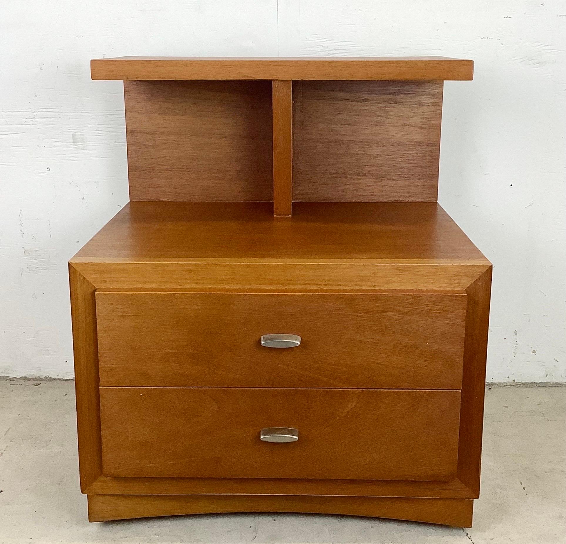 Mid-Century Modern nightstand from Phenix furniture features shapely two-tier arrangement with sculptural design and a mixture of tabletop and drawer storage. This large mid-century side table is a perfect nightstand or sofa side table set on
