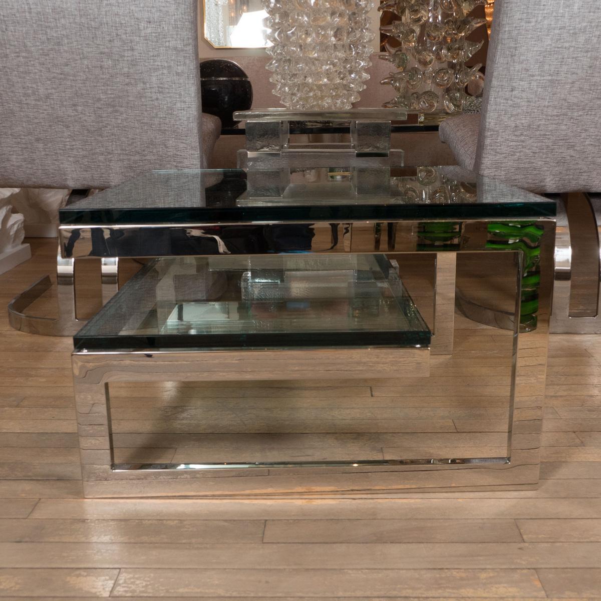Two-tier nickel and glass interwoven side table.
