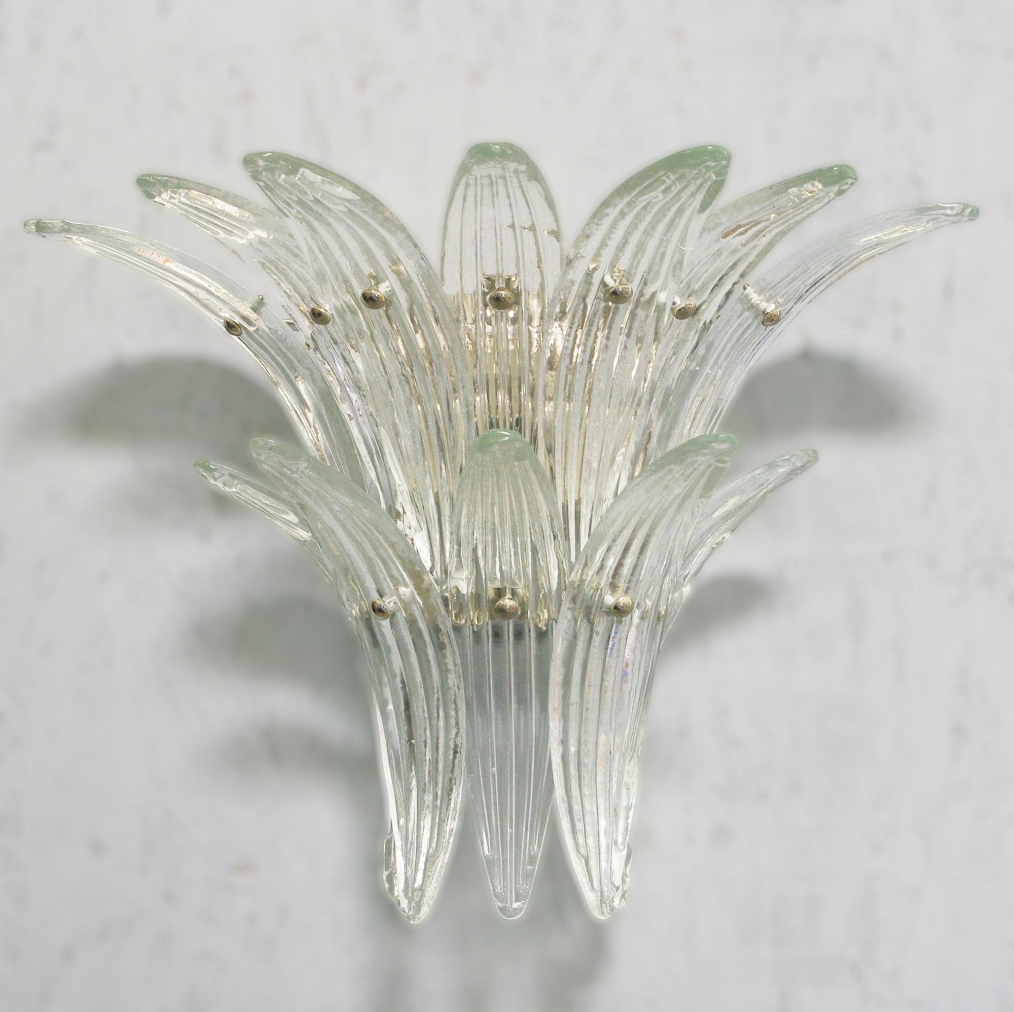 Italian wall light with 12 hand blown clear Murano glass leaves mounted on chrome finish metal frame / Made in Italy
Width: 19 inches / Height: 15 inches / Depth: 9.5 inches
2 lights / E12 or E14 type / max 40W each
Order reference #: FABIOLTD W183