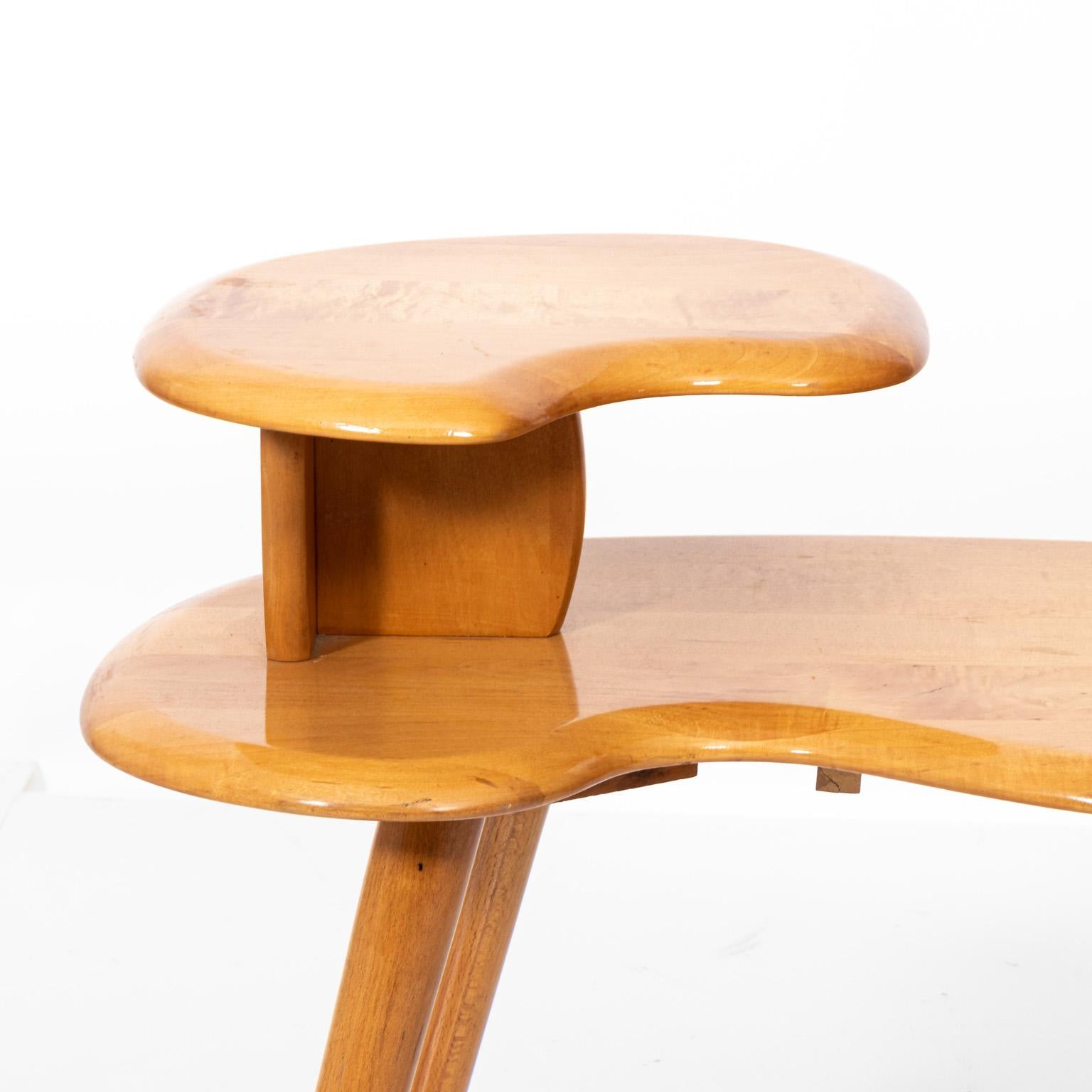 Mid-Century Modern style two tier stand with bean shaped tabletop. Please note of wear consistent with age.