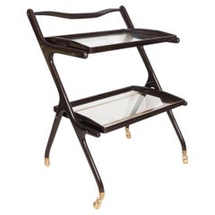Two tiered ebonized wood and glass rolling cart
