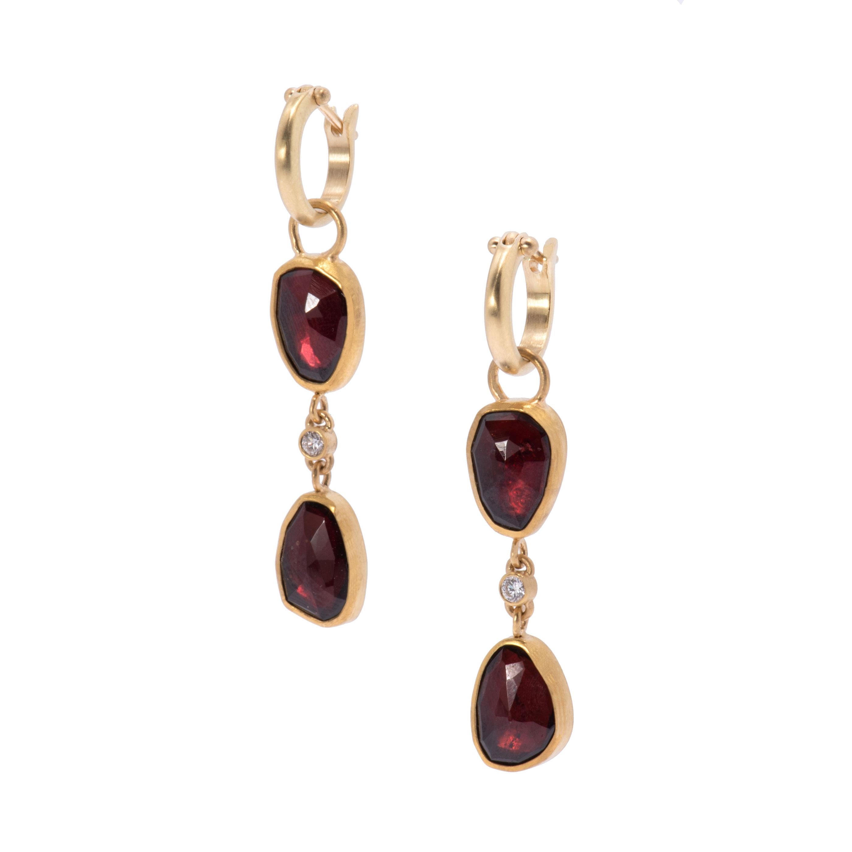 Rose Cut Garnets are set in 22 karat gold and hang tiered in pairs with winking .12 tcw diamonds and are suspended from small 18 karat gold plain hoops. Each rose cut garnet is unique as are the bezel settings which are backed in sterling silver.