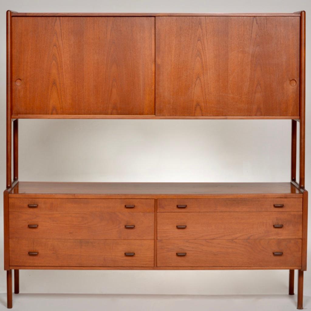 Double decker Danish teak model Ry-20 sideboard credenza by Hans Jørgen Wegner for Ry Møbler.
Fully marked and dated - January 23, 1958. 
This features six drawers with sculpted pulls, two sliding doors, adjustable interior shelving on the upper