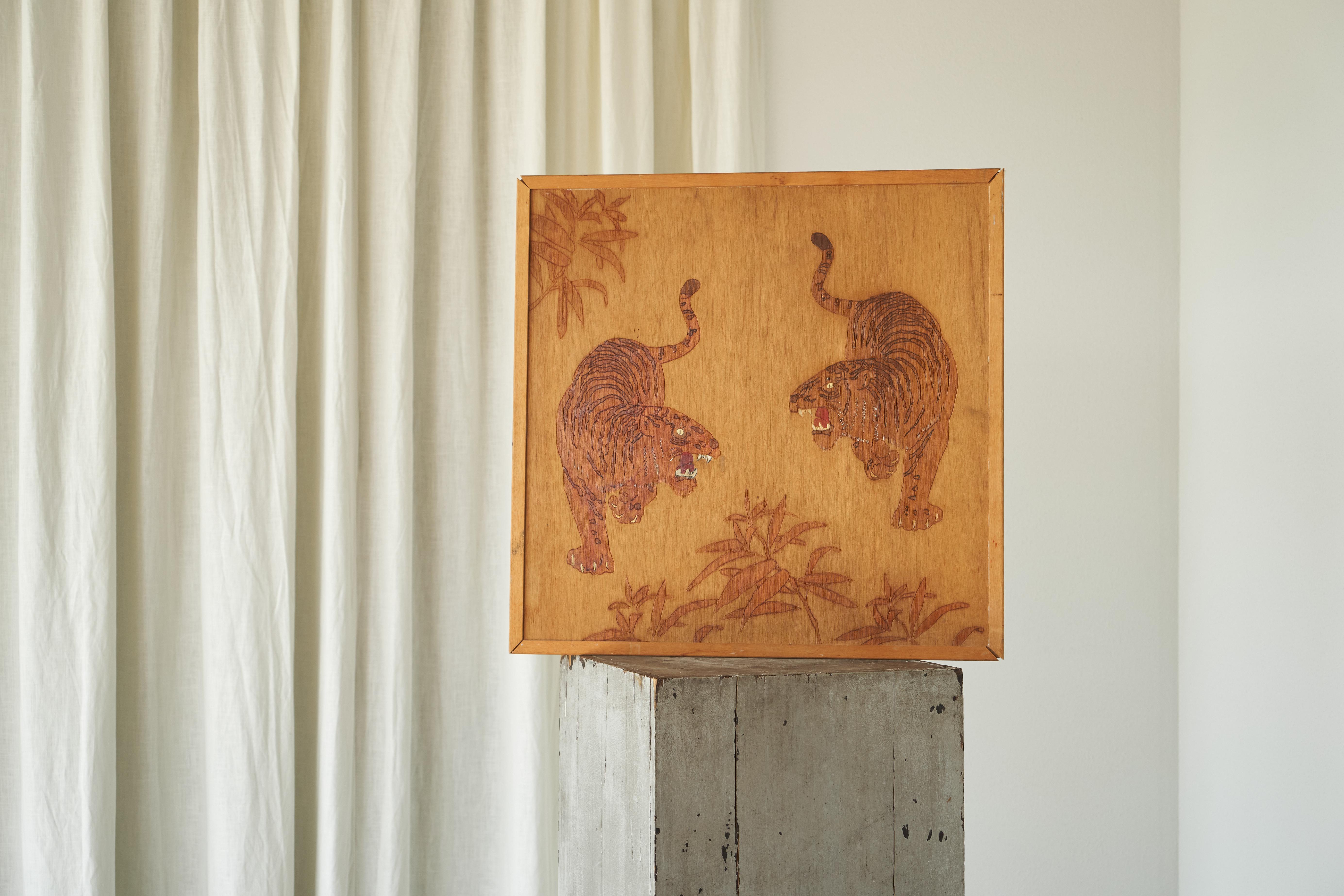 Two Tigers Carving in Wood, 1970s.

Who doesn’t love a nice tiger now and then? This 1970s wood panel with carved decorations shows a striking scene of two tigers in a natural setting. A very captivating and decorative piece that draws